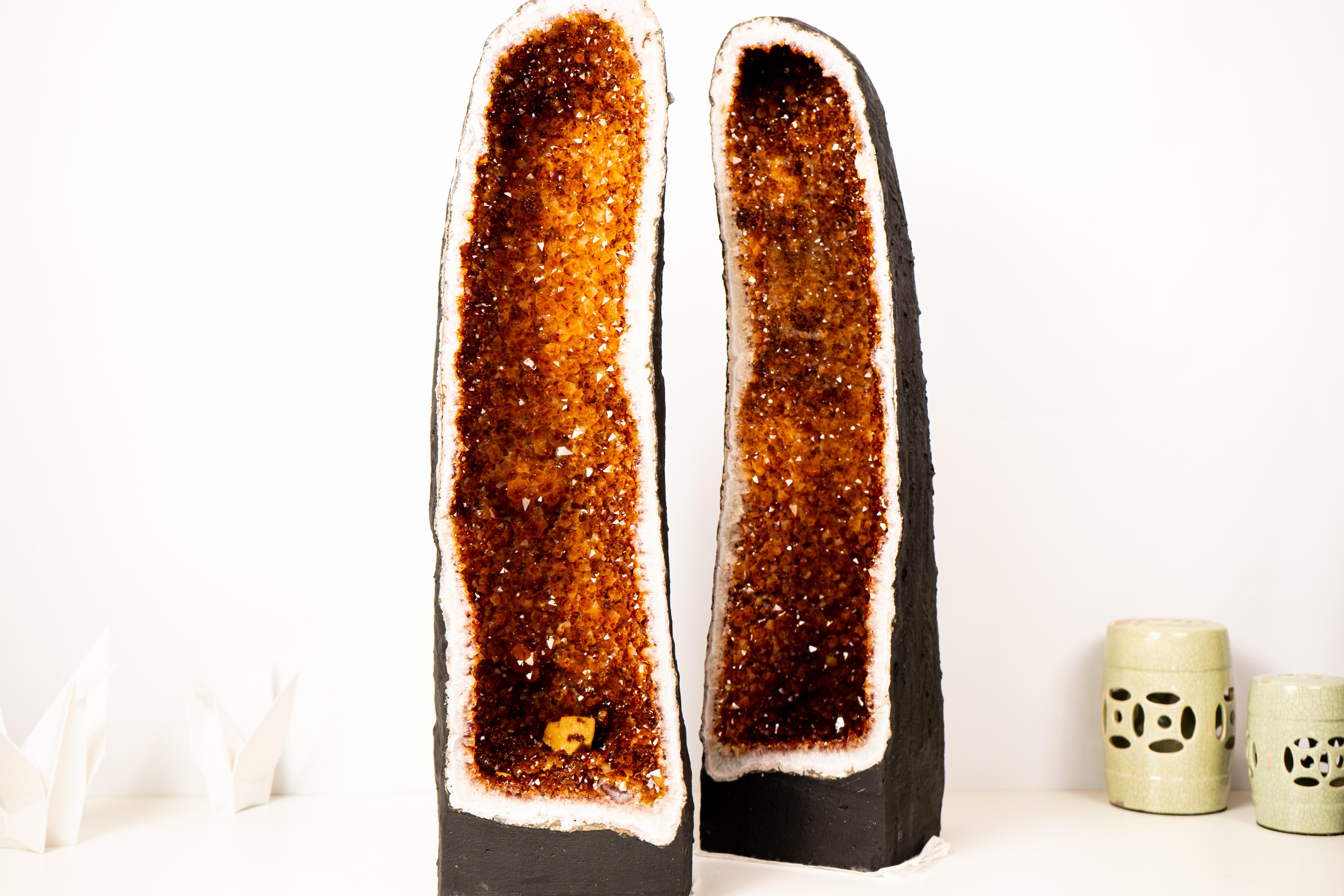 Pair of Sculptural Large Cathedral Citrine Geodes with Sparkly Madeira Citrine Druzy

▫️ Description ▫️

Showcasing the highly sought-after deep orange druzy known as Madeira Citrine, these large citrine geodes feature stunning, tall cathedral