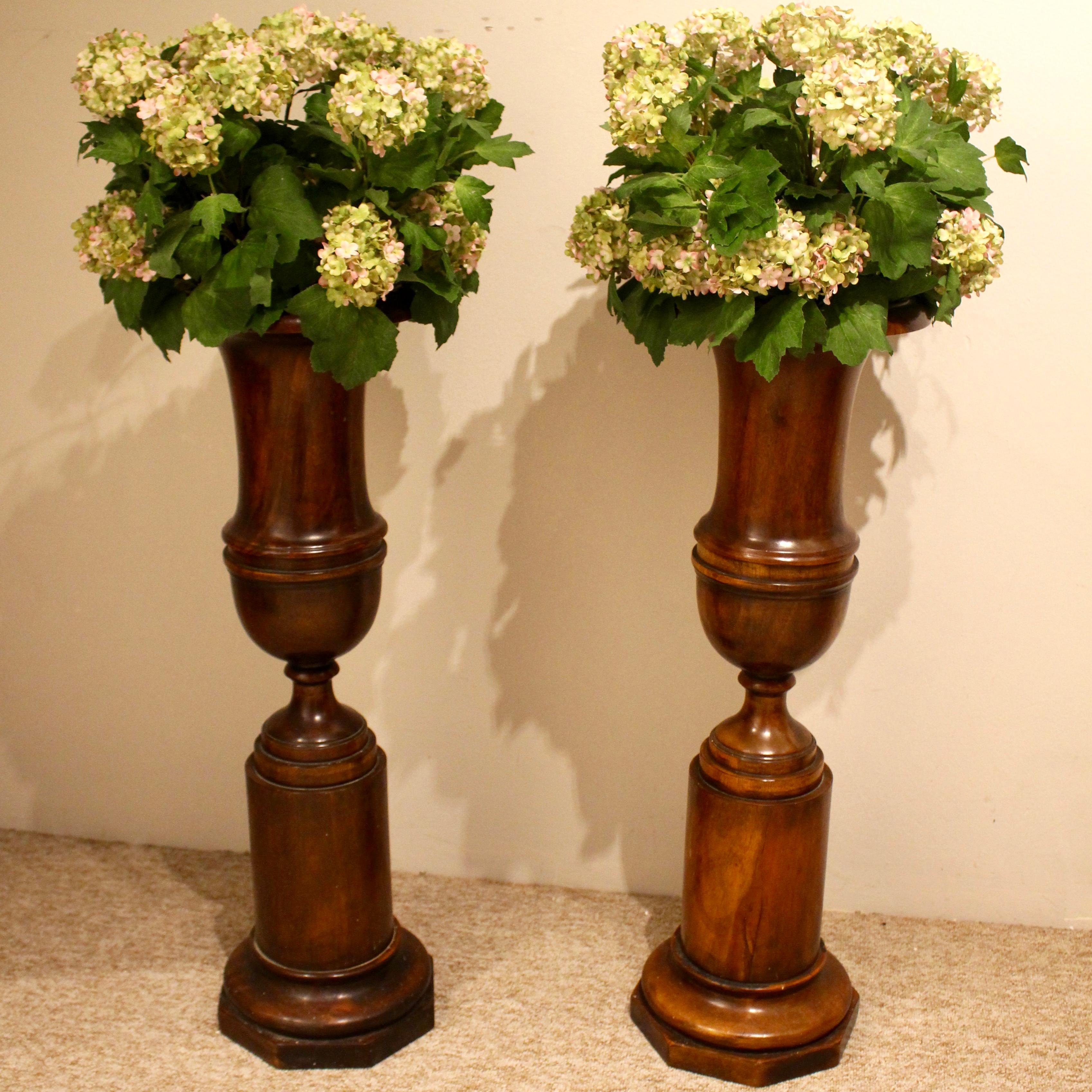 Turned Pair of Large Mahogany Classical Campana Urns For Sale