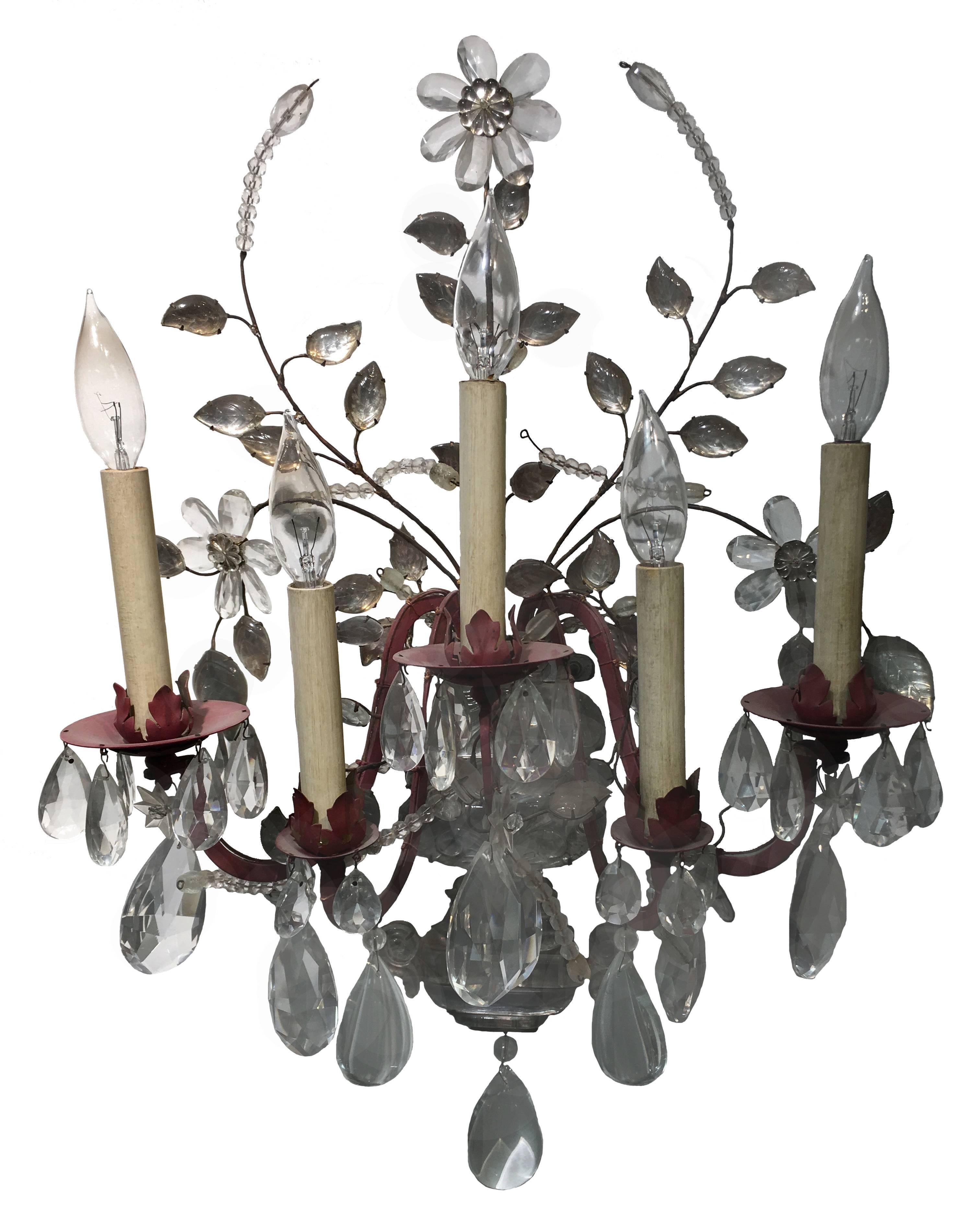 Pair of very large and important scones by Maison Baguès. Each light features five brass arms with a red clay rubbed finish. A mix of crystal drops, cut-glass leaves and flowers are all original. Each light takes five chandelier bulbs (not