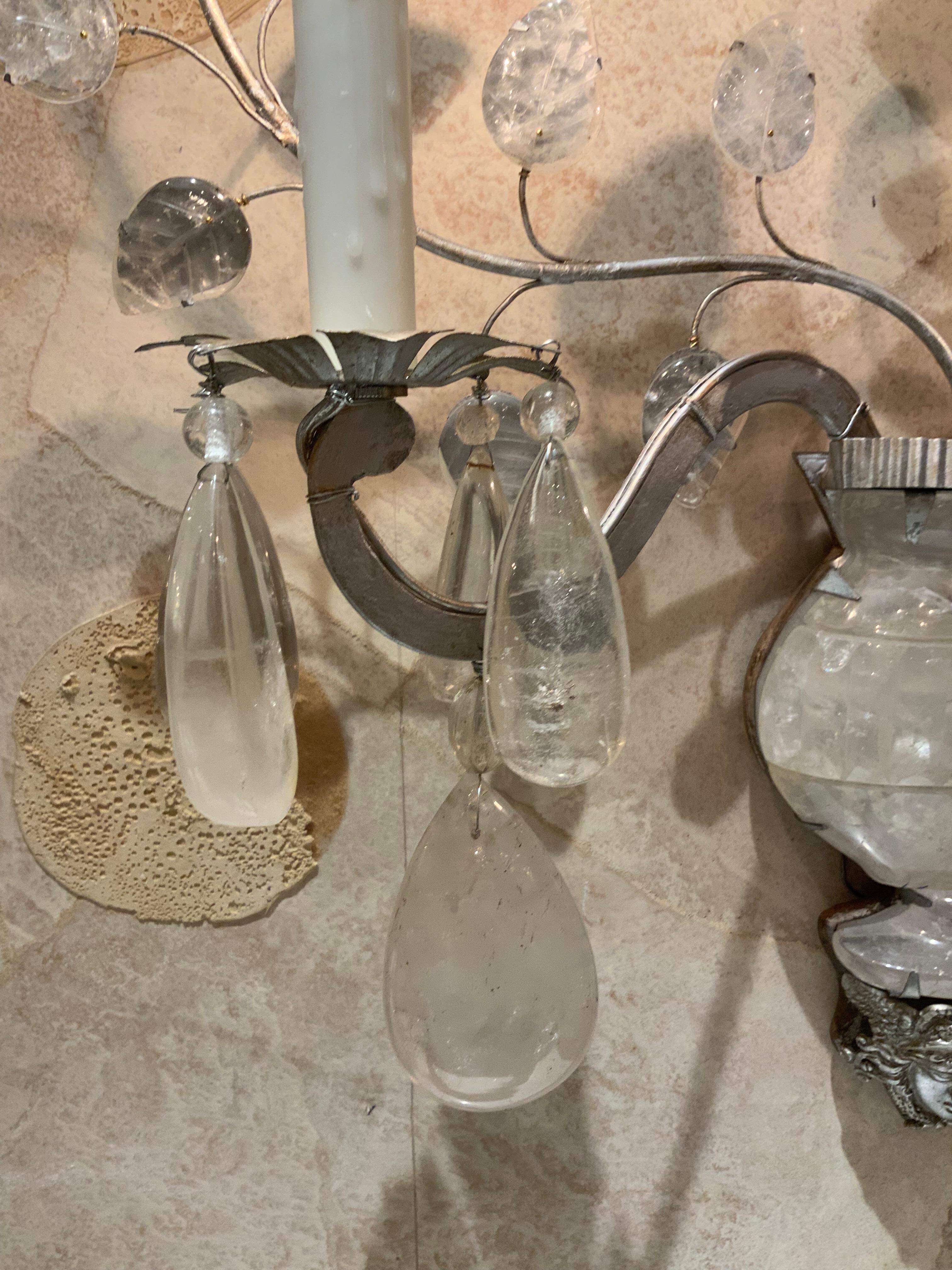 Fine rock crystal and silver gilt iron are constructed in
A way to create very artistic styling. They have new
Wiring and each have two lights.  all parts and pieces
Are original and they are in fine condition. A rock crystal 
Urn/planter is