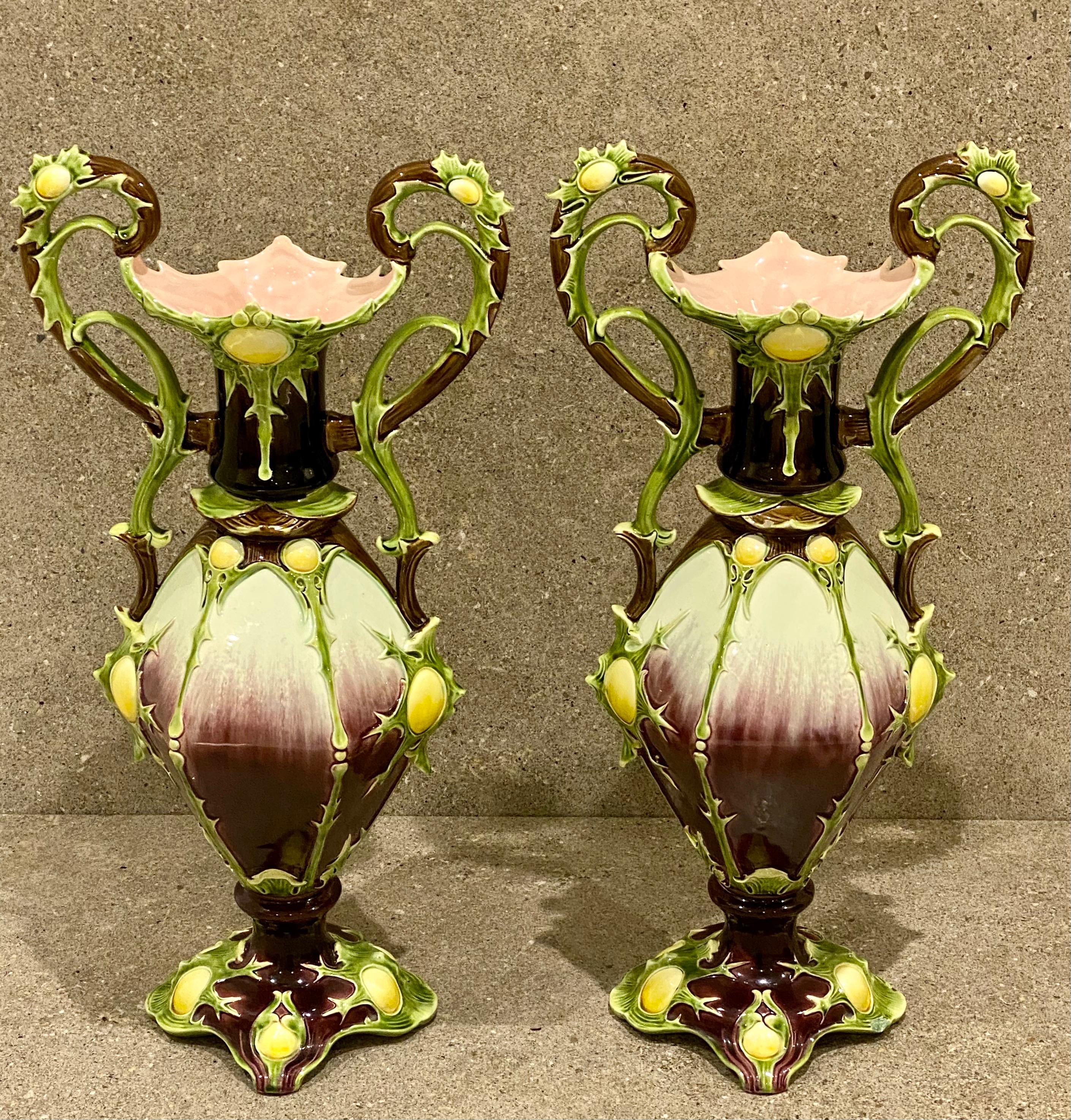 Impressive pair of Majolica vases by Julius Dressler, circa 1885. These large amphora-styled vases captivate due to the unusual design and the marvelous colours. Measure: 20