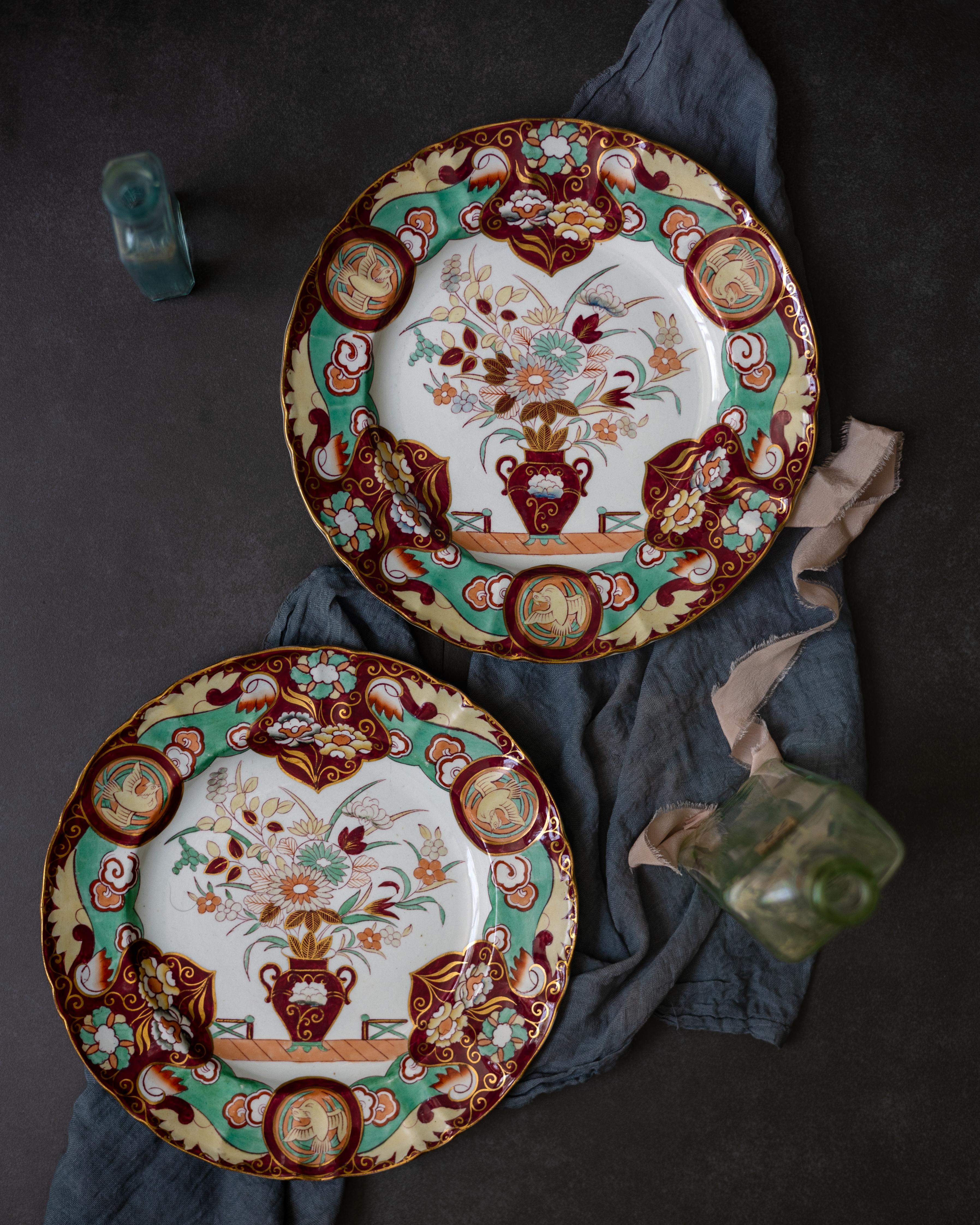 A pair of Mason’s ironstone dishes decorated in the Regency chinoiserie style, circa 1860. The plates’ pattern, Fence Vase Doves, is rendered in maroon, mint green, and buff.

Mason’s Patent Ironstone China was introduced in 1813 as a less