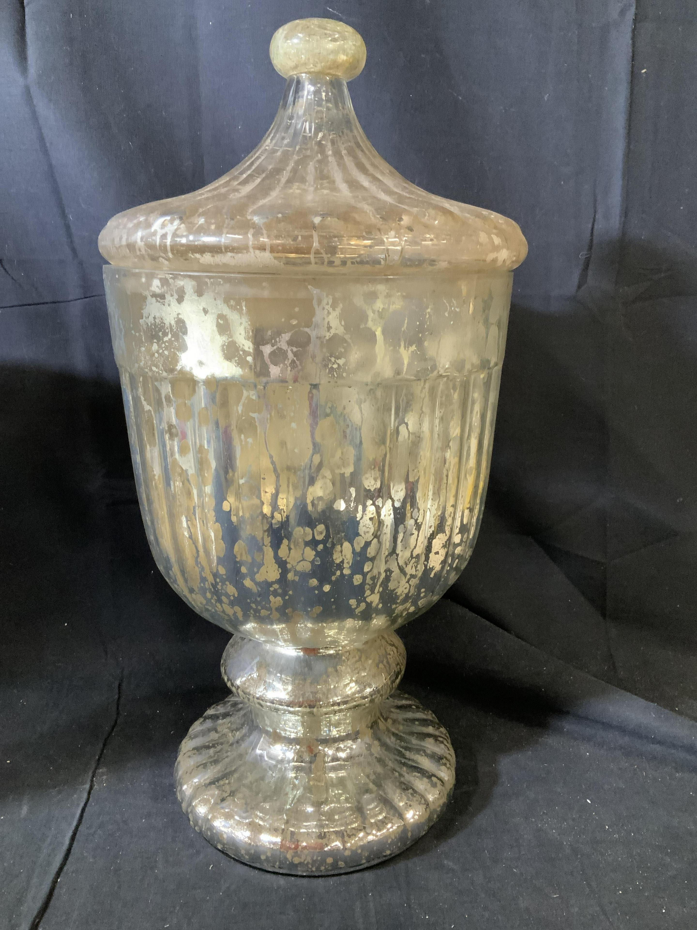 Pair of highly decorative large bolubous form mercury glass jars or lidded urns with lids in the Hollywood Regency style in gold and silver crackle style glass. Each has fluted pedestal base, bulbous centers, fluted lids tapered to ball finials.
   
