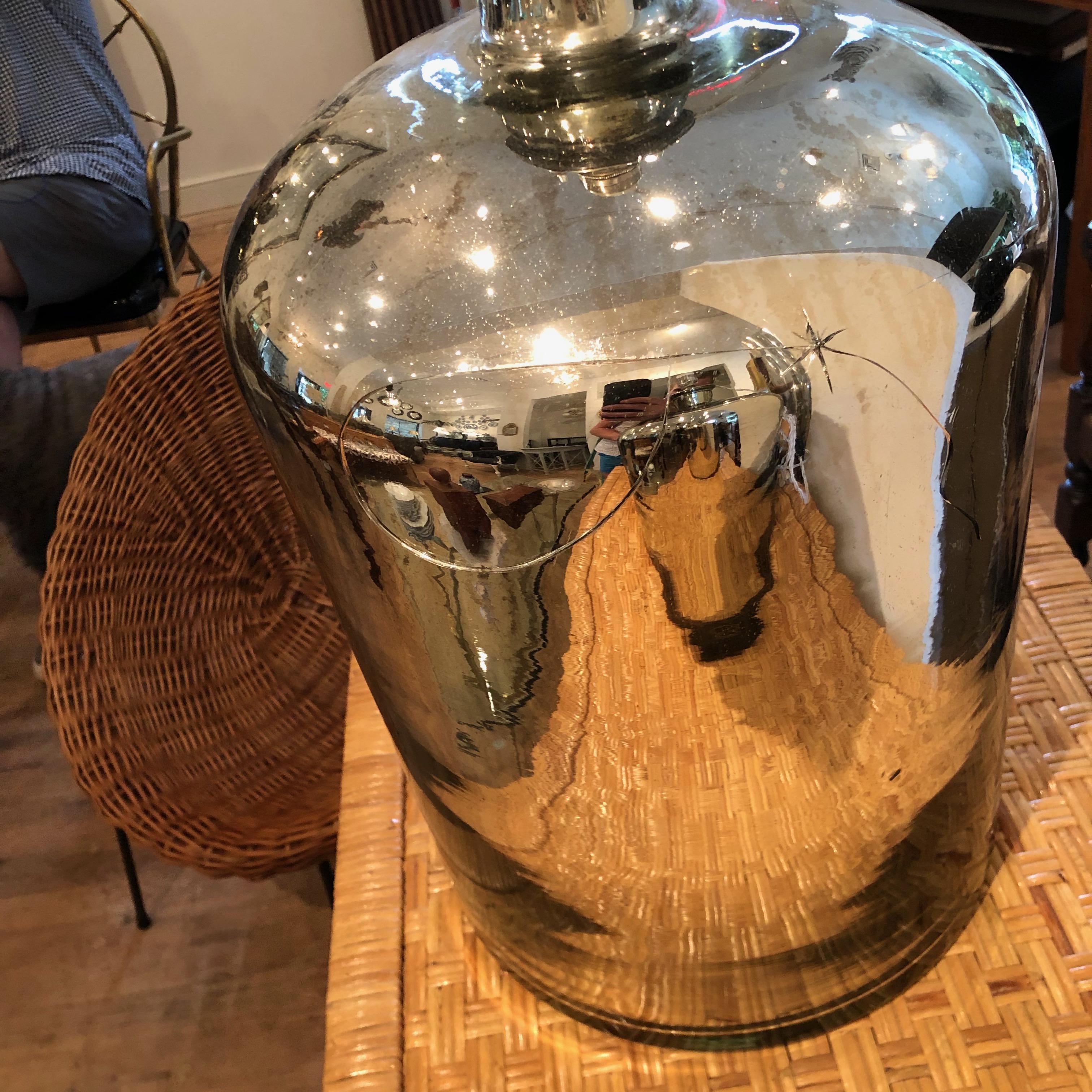 Pair of large Mercury glass table lamps.

One of the lamps has a crack, it has been repaired (sealed).