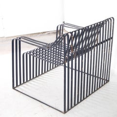 Pair of large metal armchairs