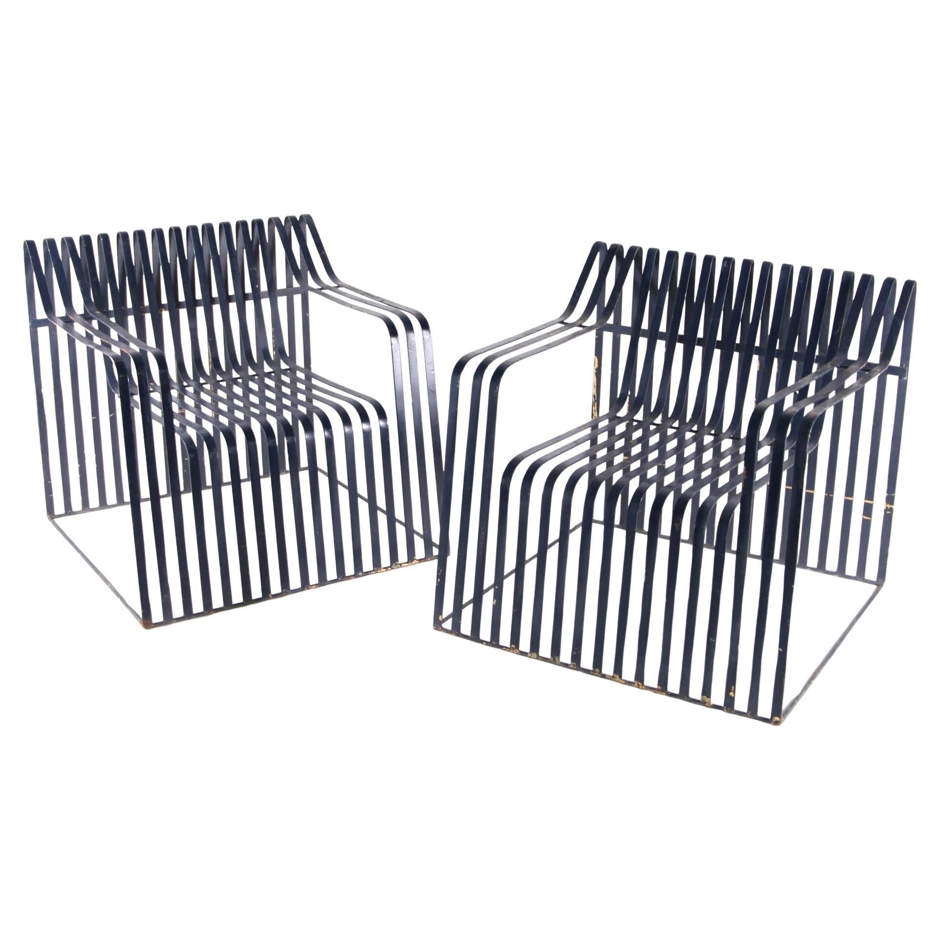 Pair of large metal armchairs