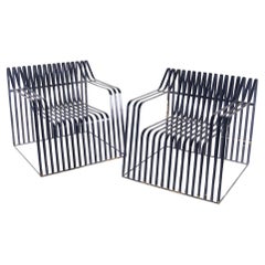 Pair of large metal armchairs