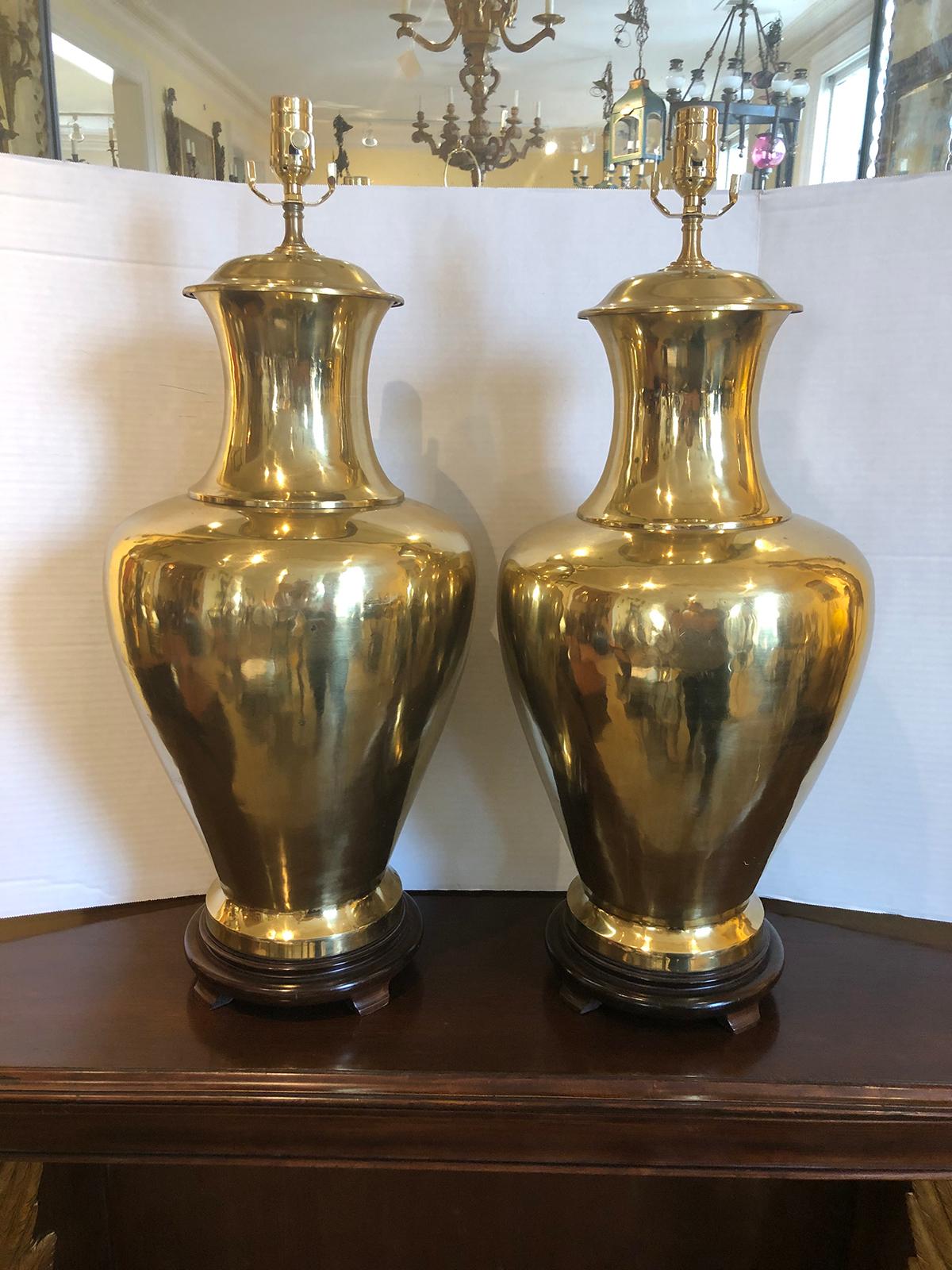 Pair of large mid-20th century urn shaped brass lamps
Striking
New wiring.