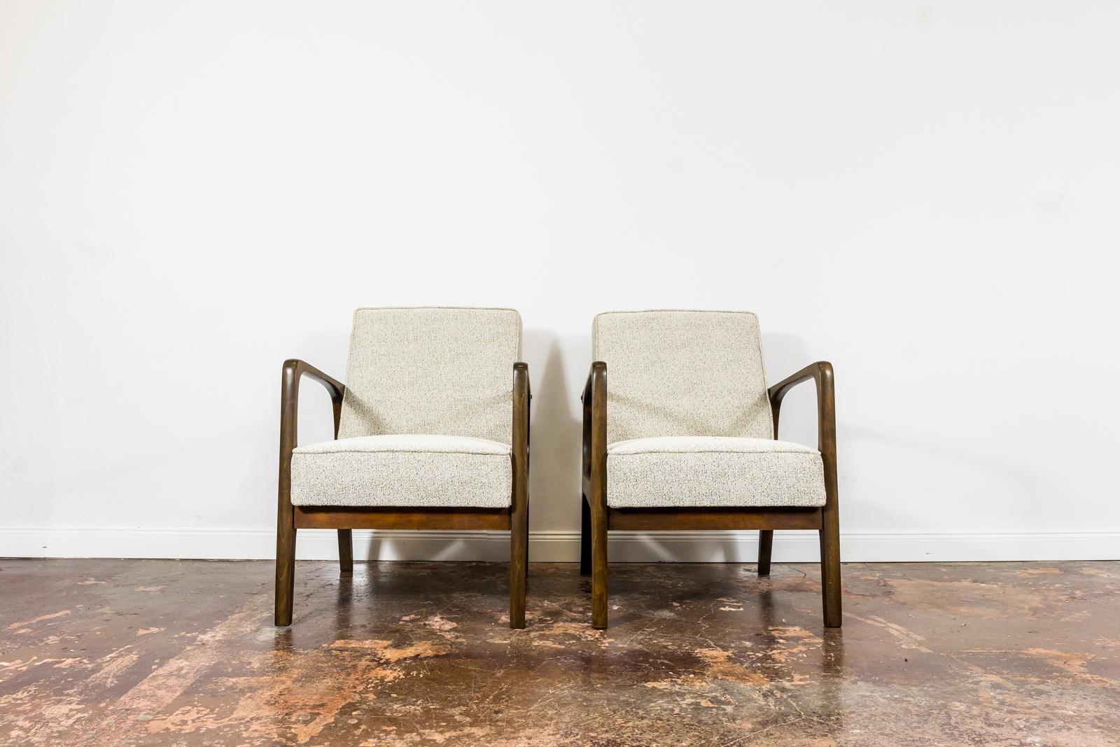 Pair of  Mid-Century armchairs from Prudnickie Fabryki Mebli 1960's, Poland.
Solid beech wood frames have been completely restored and refinished.
Reupholstered in black&white fabric.