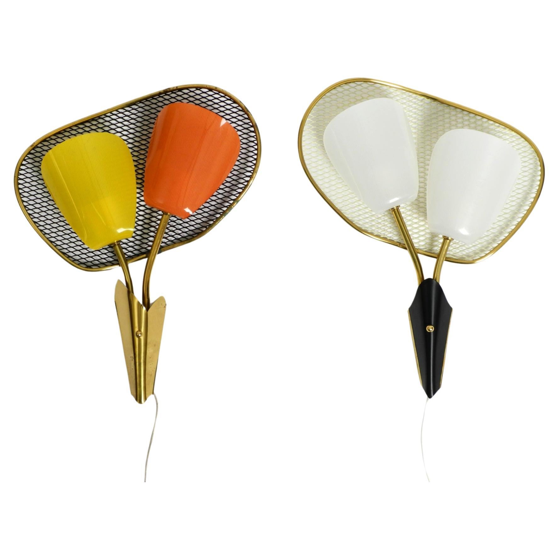 Pair of large Mid Century expanded metal wall lamps with plexiglass shades