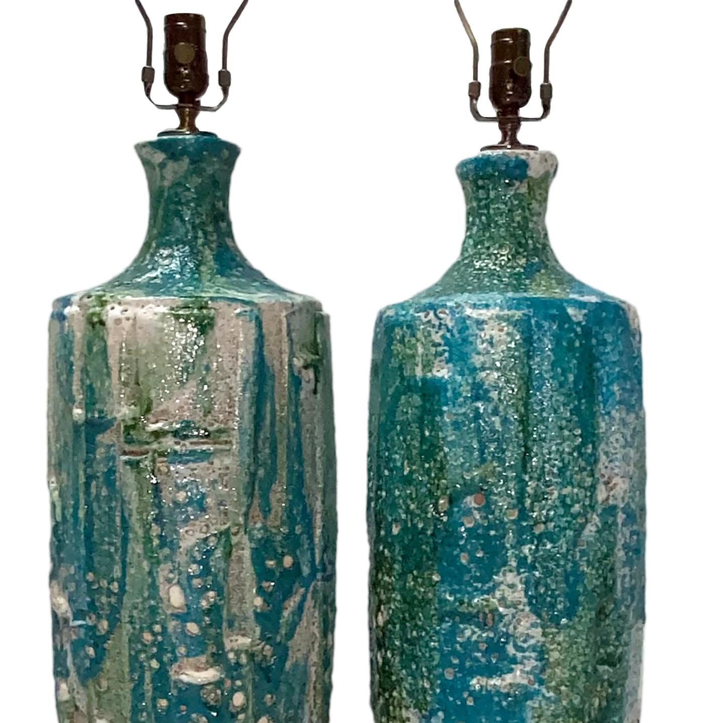 A pair of Italian circa 1950's porcelain table lamps with turquoise and white tones.

Measurements:
Height: 25