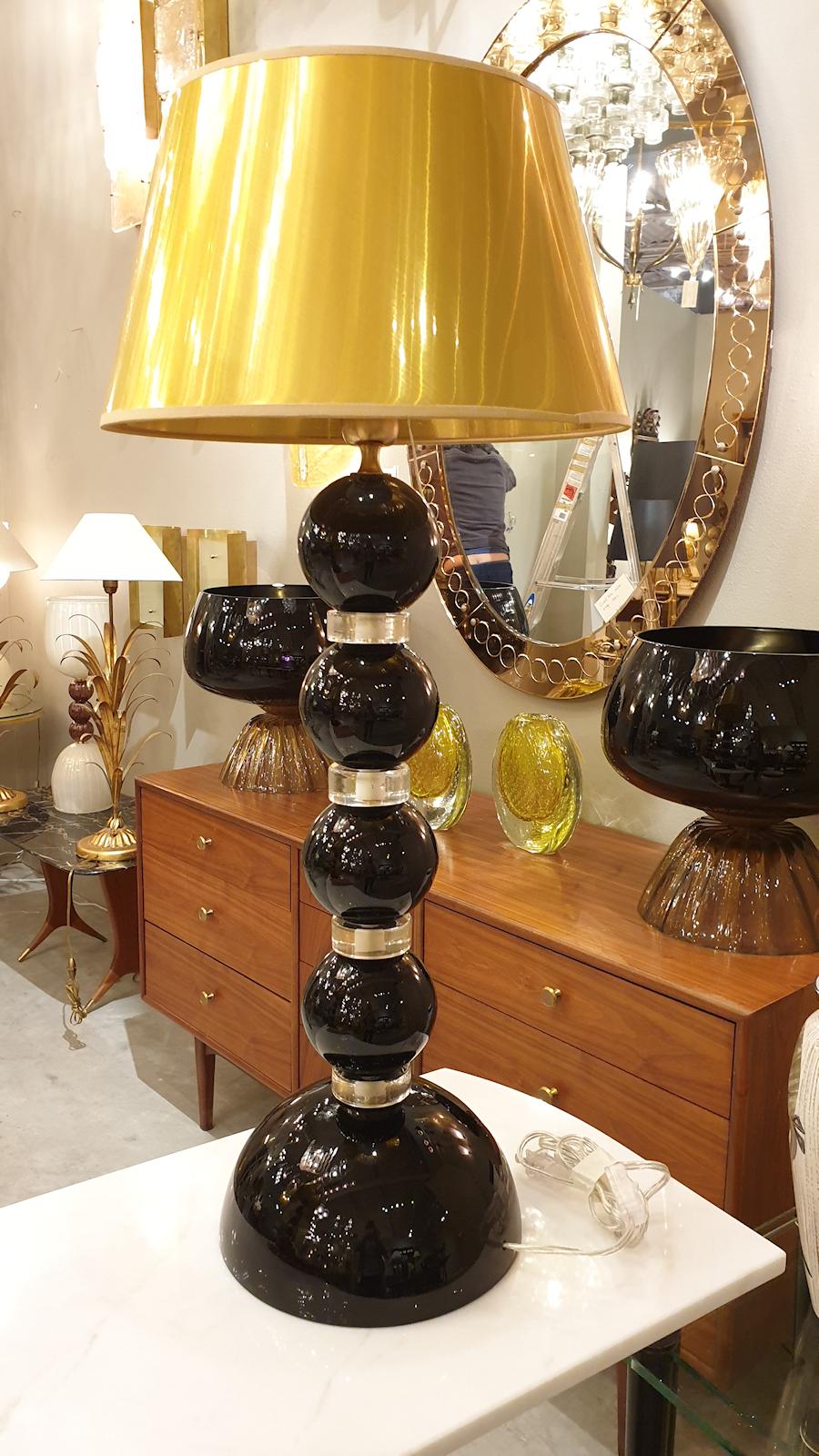 Pair of large opaque black and translucent gold Murano glass, Mid-Century Modern table lamps.
Murano, Italy, 1970s
Sold with new gold color shades.
1 light each, rewired for the US.
Classic with a modern touch. 