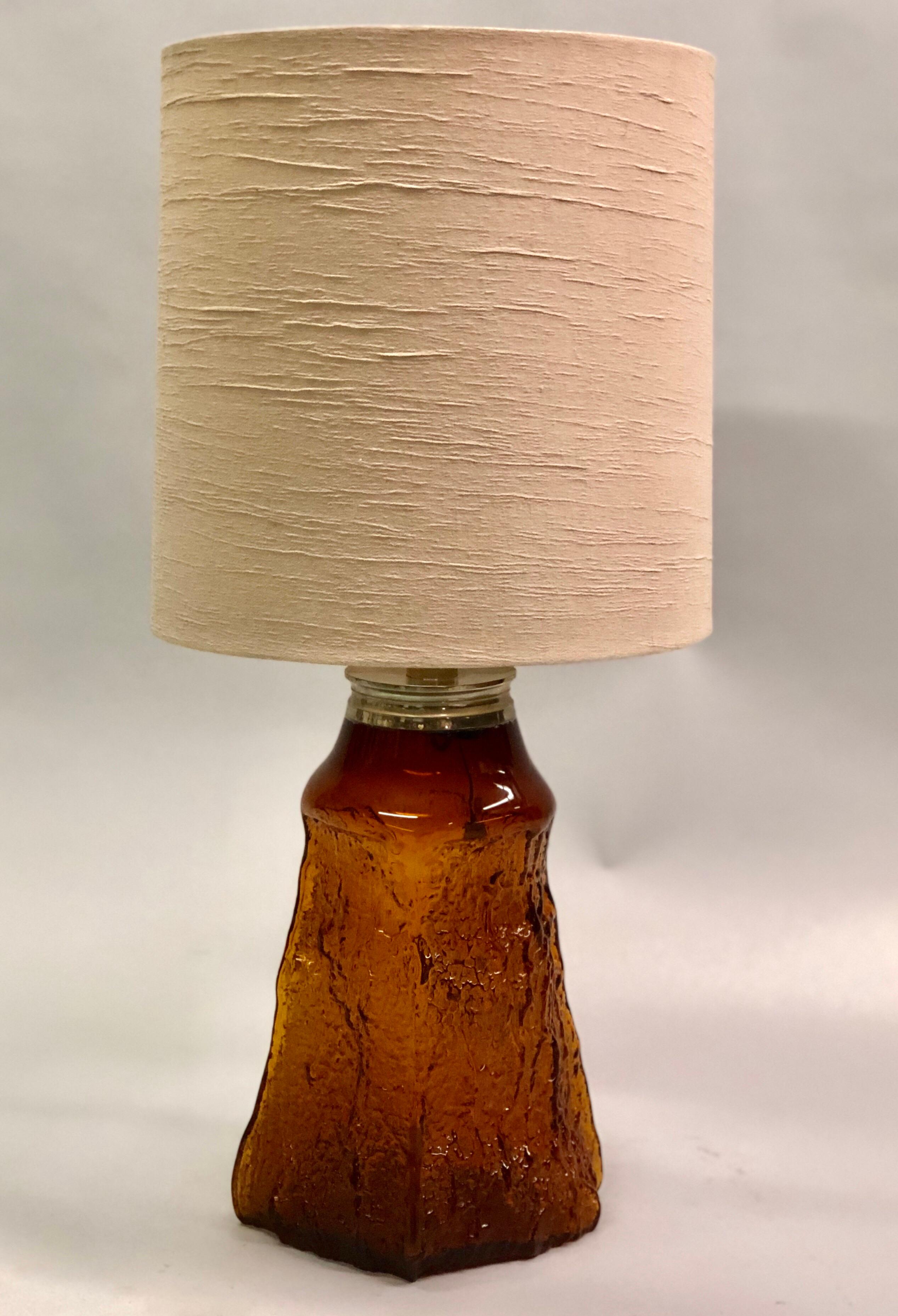 Extraordinary, rare pair of Mid-Century Modern, mold blown, amber glass lamps with an organic surface in beautiful relief. 

The lamps have rare large size and a subtle range of color that reflect light according the depth of relief. Exquisite