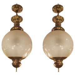 Pair of Large Mid-Century Modern Brass and Glass Chandeliers by Dominioni, 1960s