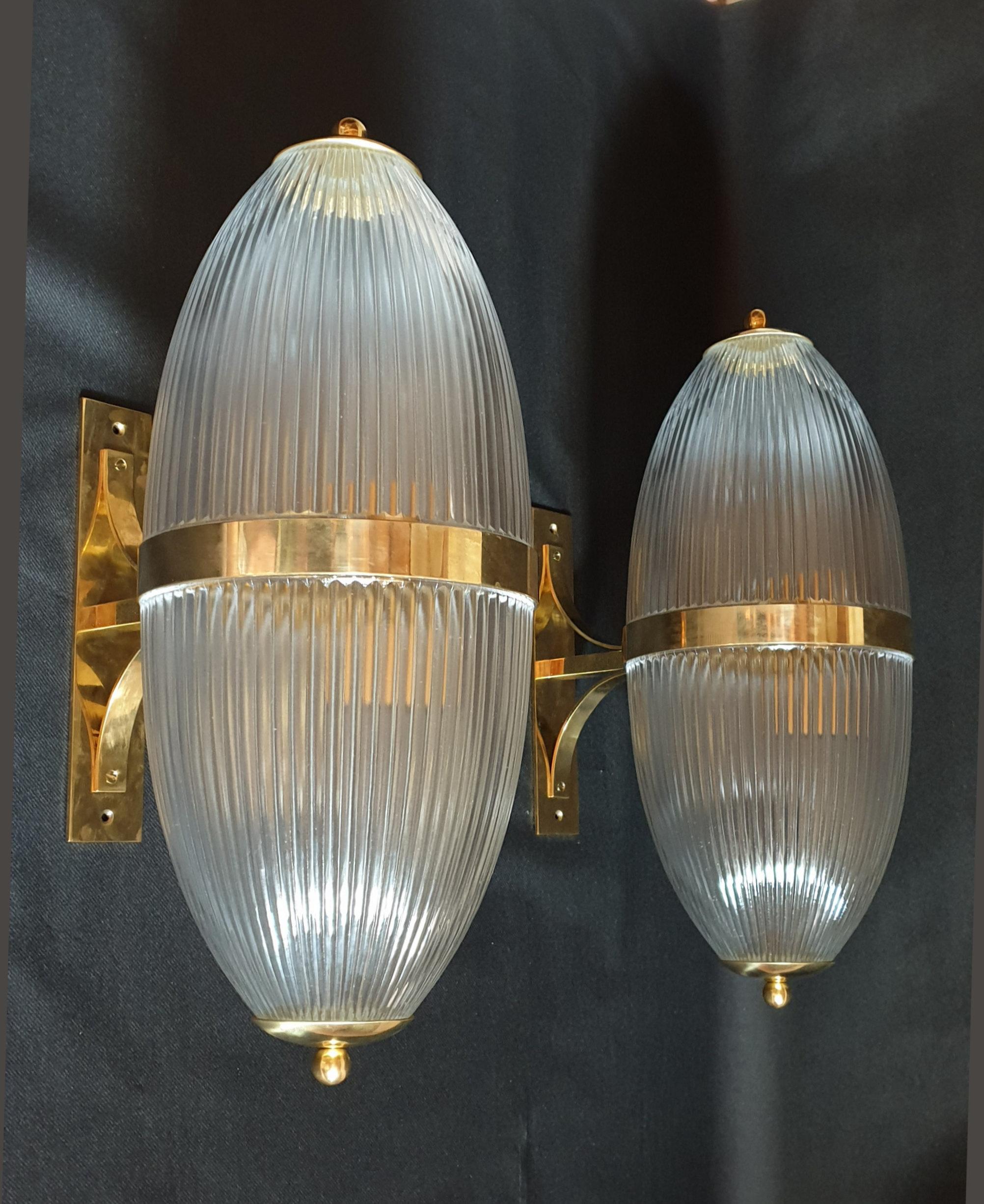 Pair of large Italian lanterns or wall sconces, in clear translucent glass and brass mounts, with an ovoid shape.
2 lights in each: one up, one down. Rewired for the US.
Attributed to Ignazio Gardella for Azucena, Italy, 1960s
Beautiful quality