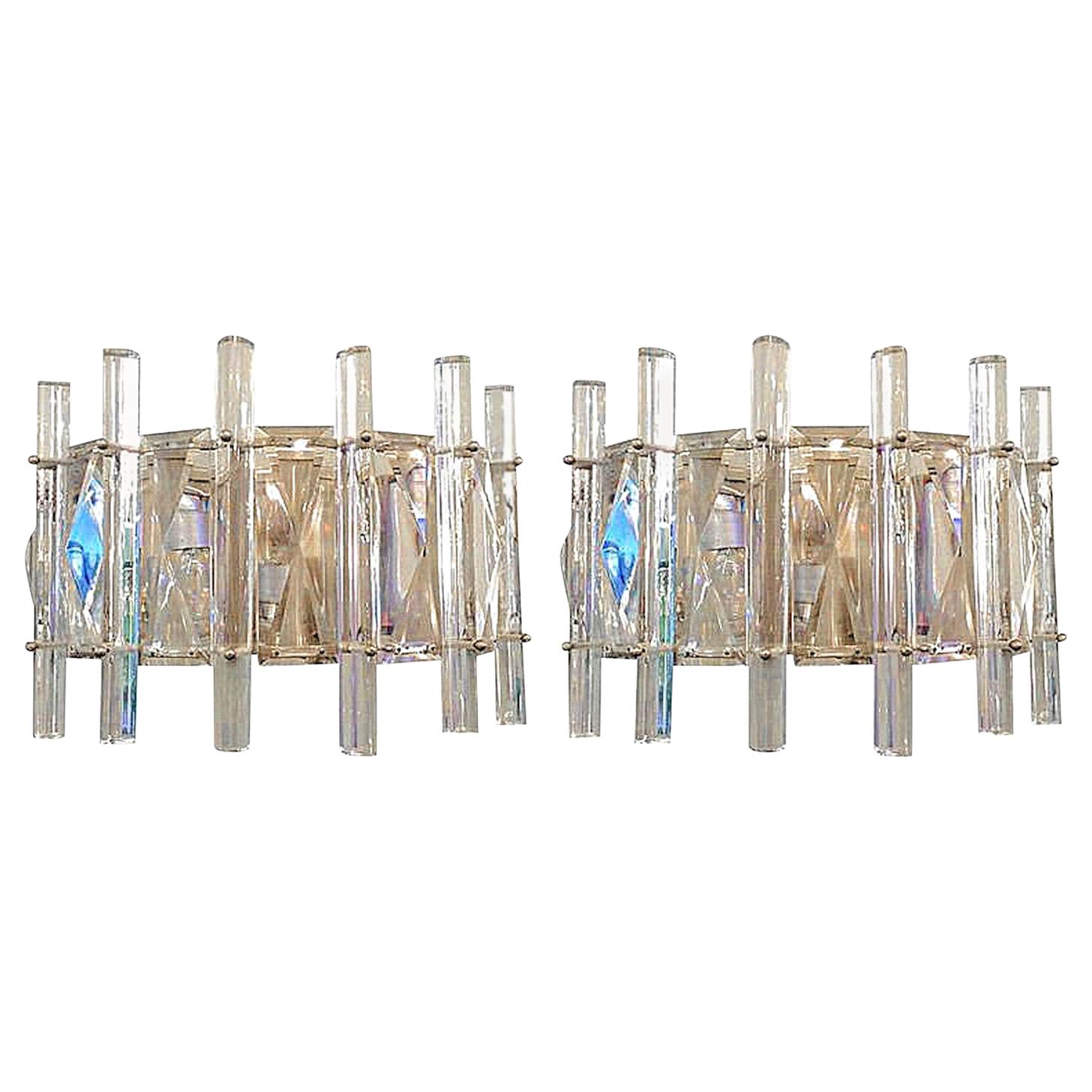 Pair of Mid-Century Modern French half moon shaped, cut crystal and chrome-plated sconces.
This lovely pair of sconces looks straight out of the 