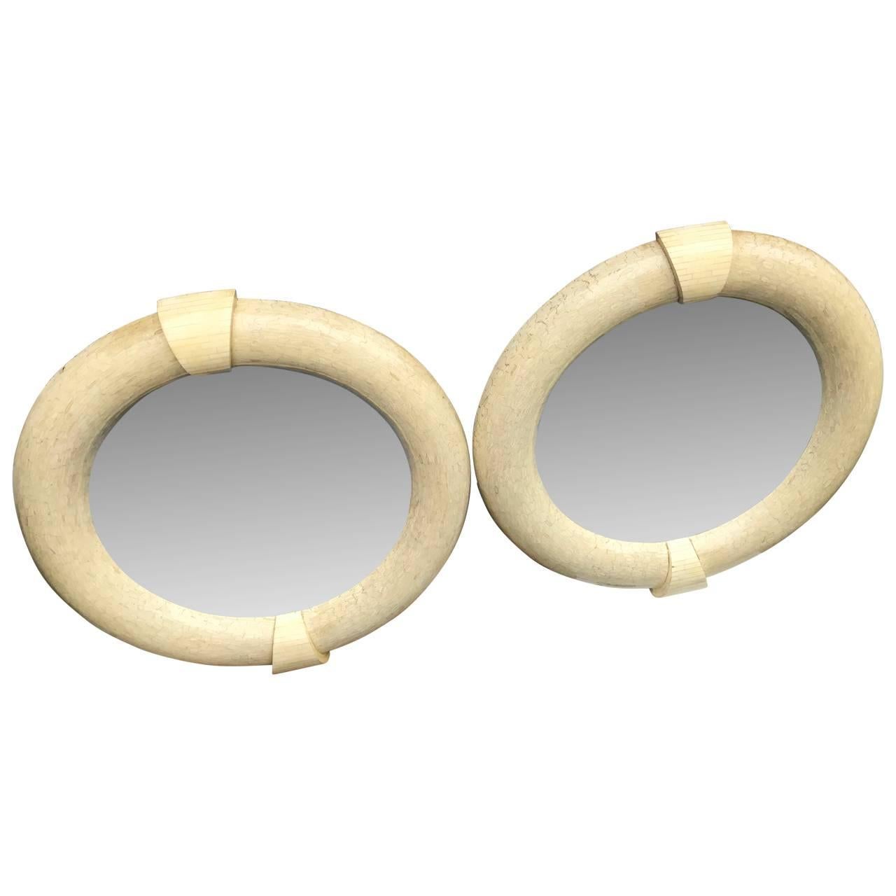 Pair Of Large  Mid-Century Modern Karl Springer Tessellated Round Wall Mirrors

Very rare pair of large Mid-Century Modern mirrors, spanning 48 inches wide and 51.5 inches tall.
The four keystones are tessellated in plain vintage white bone and the