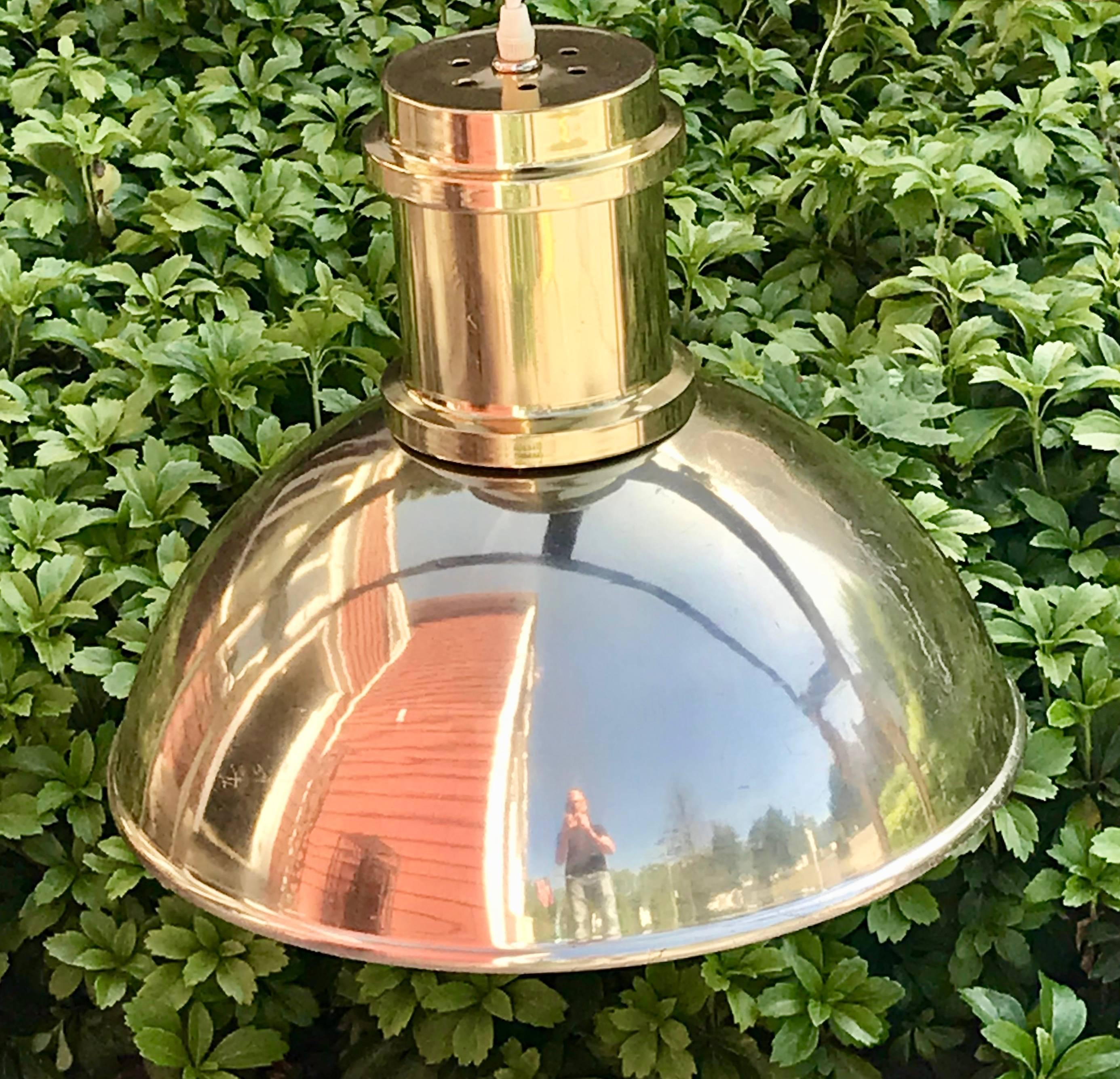 Nice pair of mid century round pendant lights, lacquered brass plated on aluminium shells, very lightweight. Possibly Lightolier, but no markings, original ceiling plates included. Multiple surface scratches on both.