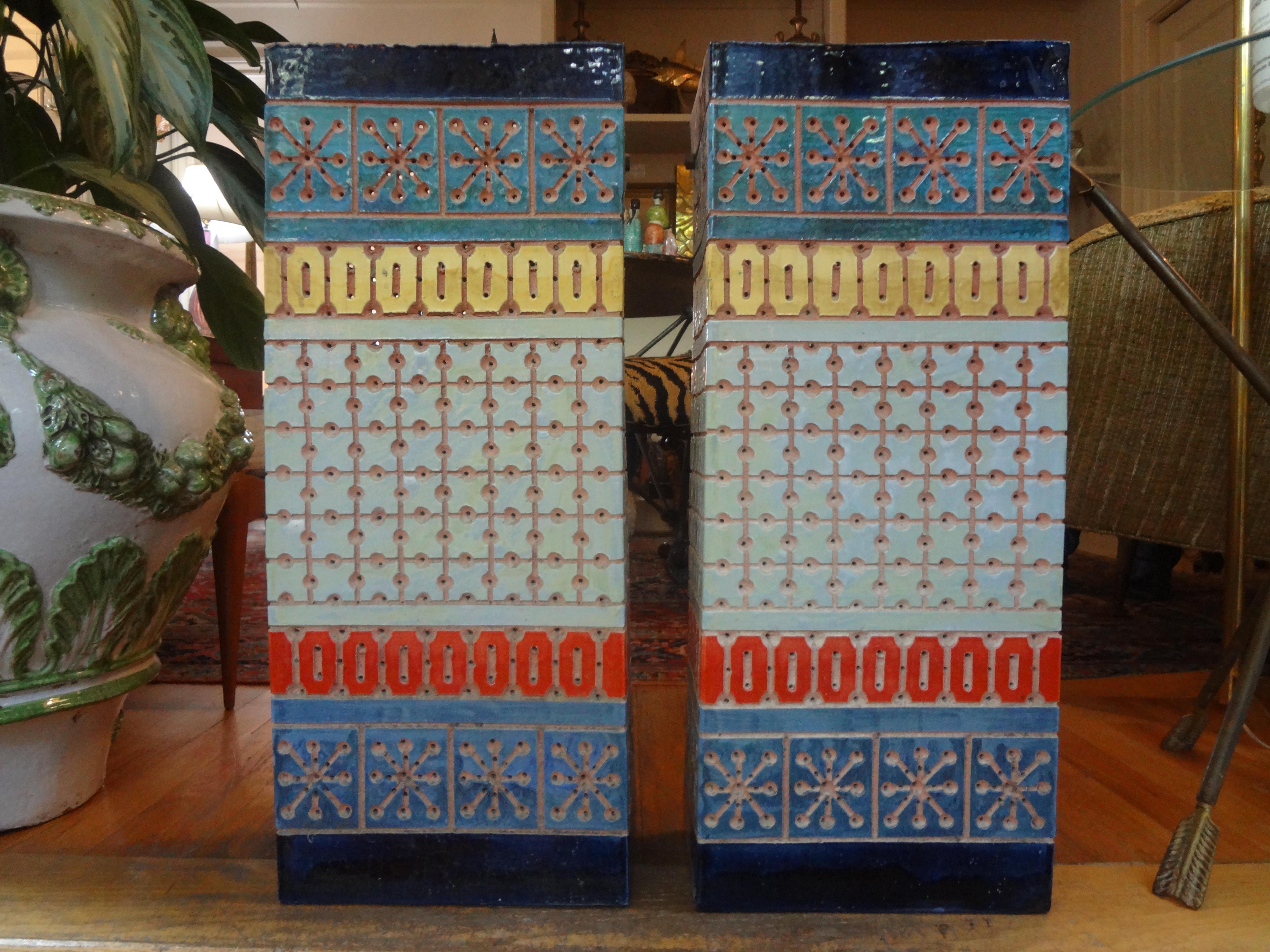 Stunning pair of midcentury perforated glazed terracotta sconces designed by Beaumont Mood. These vintage perforated sconces are in very good condition and create a beautiful warm glow when lit. These great sconces were created using a beautiful