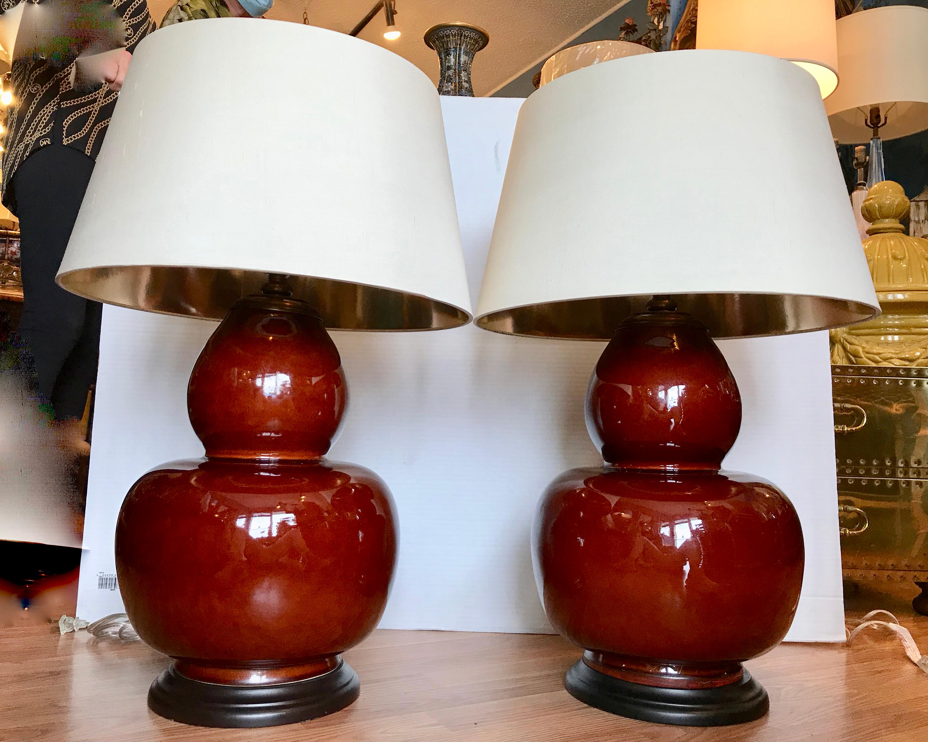 Unusual gourd form.
The lamps are generously scaled and fitted with quality shades.
Dramatic scale and proportions. (measurements include shades).