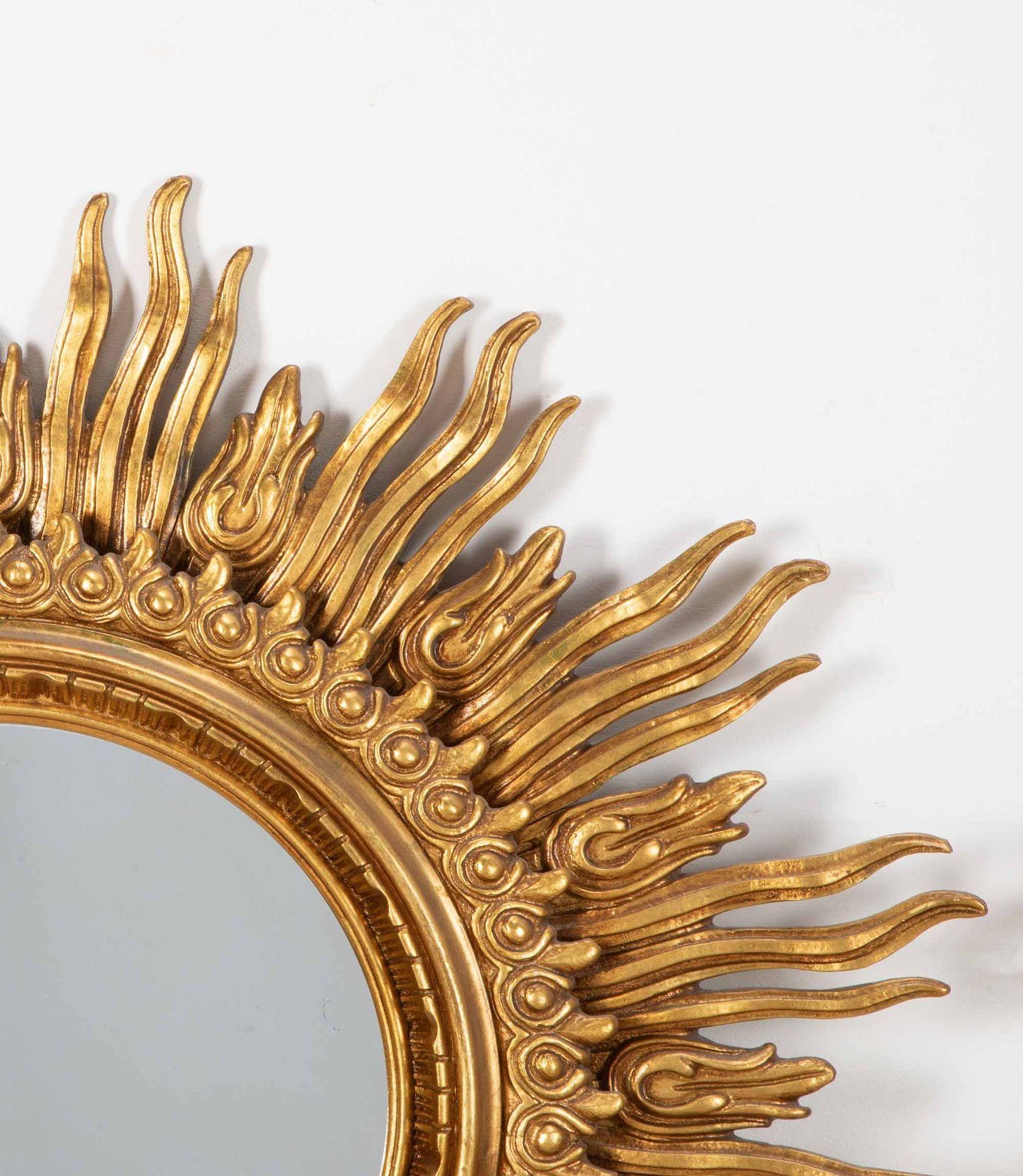 Pair of Mid 20th Century Spanish sunburst mirror of grand scale. 
Designed by Francisco Hurtado, Valencia, Spain.
Hand carved gilt wood frame, double-tiered frame of sun-rays with beautiful original patina. With the original glass plate.
Circa 1950.