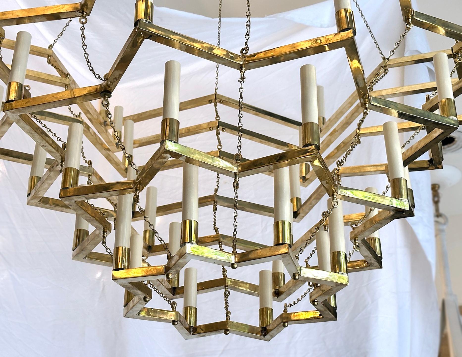 A pair of circa 1950's French gilt bronze chandeliers. Sold individually.

Measurements:
Diameter: 60