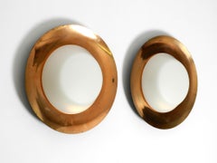 Pair of large Mid Century wall or ceiling lamps made of glass with copper-plated