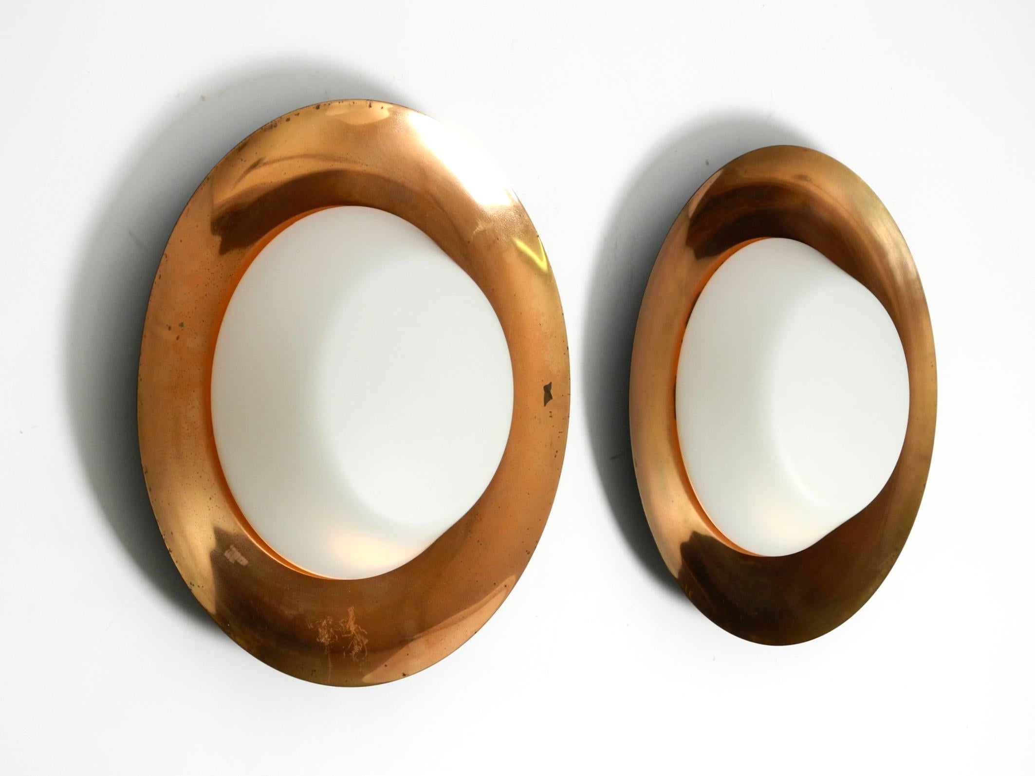 Mid-Century Modern Pair of large Mid Century wall or ceiling lamps made of glass with copper-plated For Sale