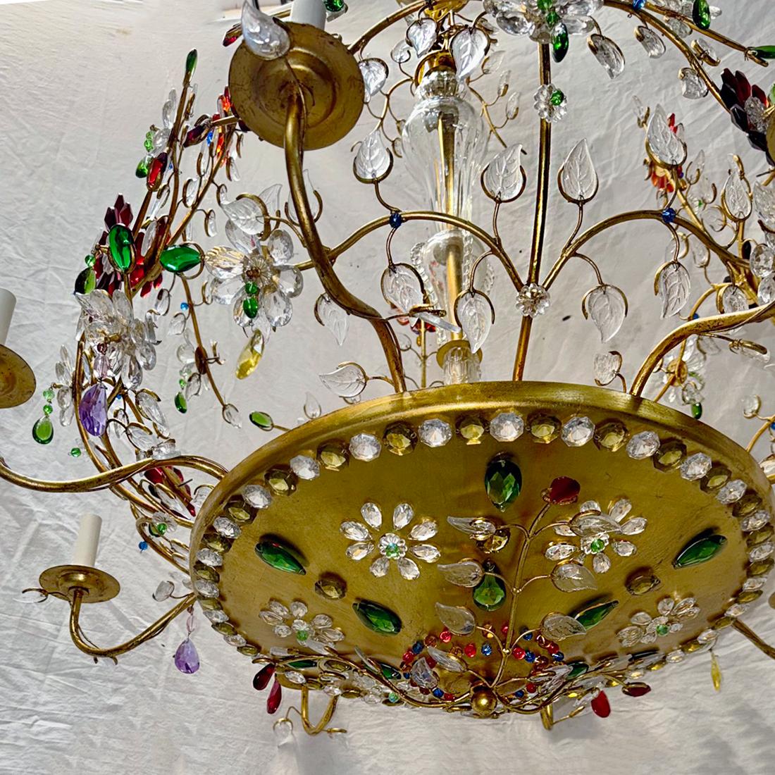 Pair of French 1960's gilt metal and crystals chandeliers with 8 interior lights and 4 candelabra interior lights. Branches with molded glass leaves and flowers. Sold individually.

Measurements:
Drop: 50