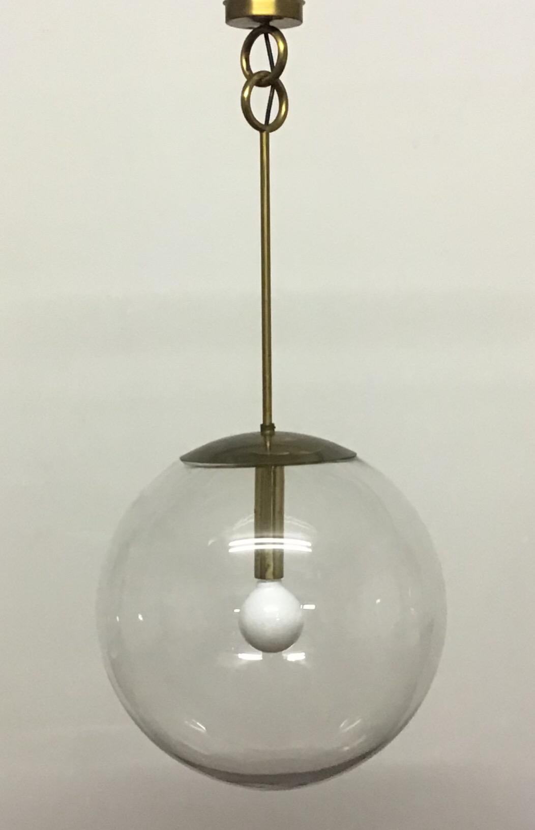 Huge pair of midcentury glass globe pendants hanging on brass frame, Germany, circa 1960s.
Socket: Each one x Edison (E27) for standard screw bulb.
Excellent condition.
     