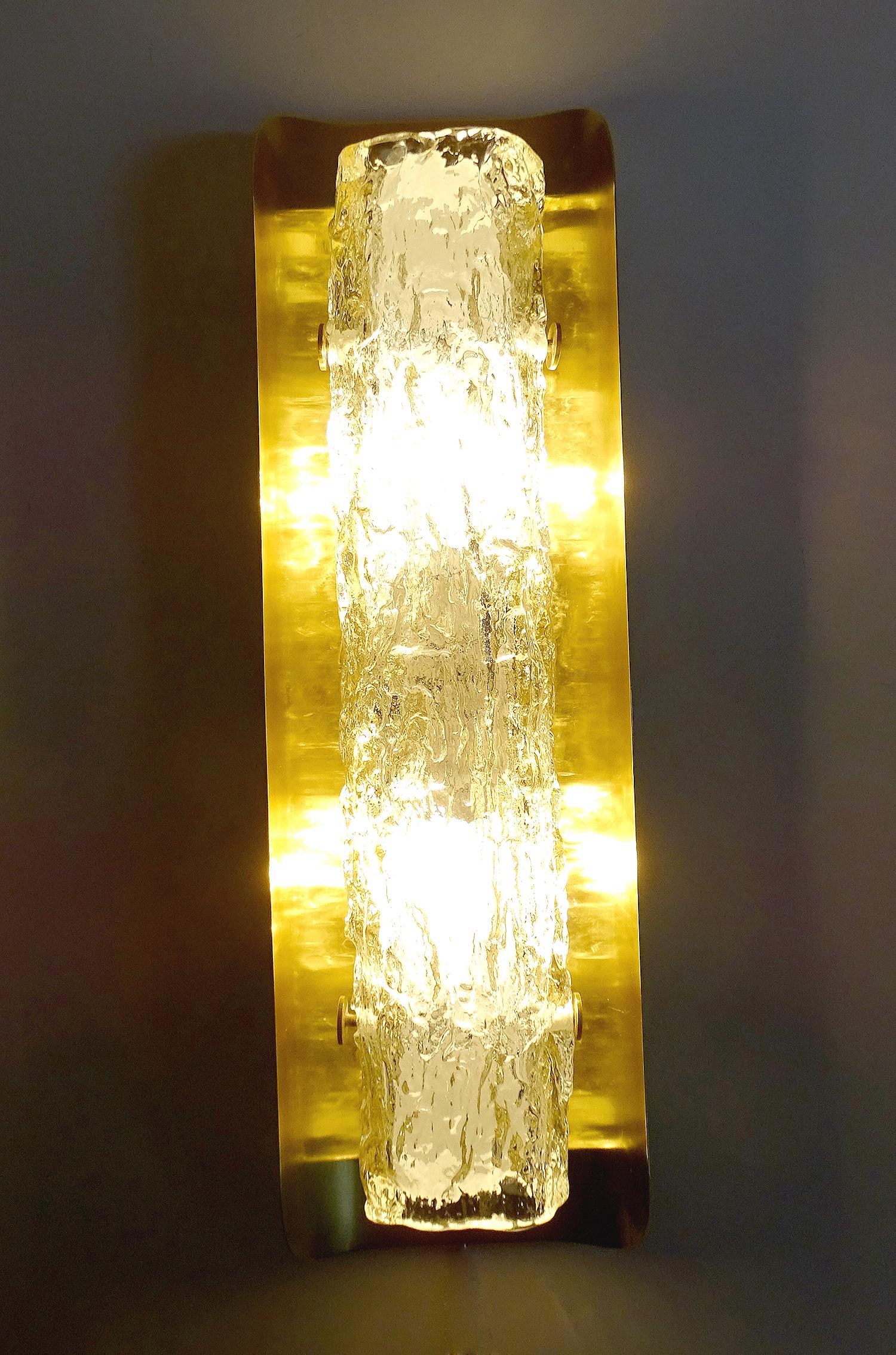 Rare and fabulous of vintage Mid-Century large tubular sconces by Kaiser with handcrafted Murano glass, They have a convex brass base which reflect the light and glass refractions, this is a very rare modell produced in very small output with two