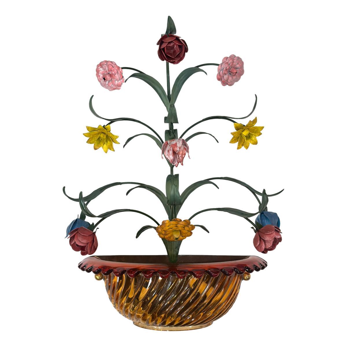 A pair of circa 1950's Italian Venetian glass sconces with painted tole flowers.

Measurements:
Height: 26