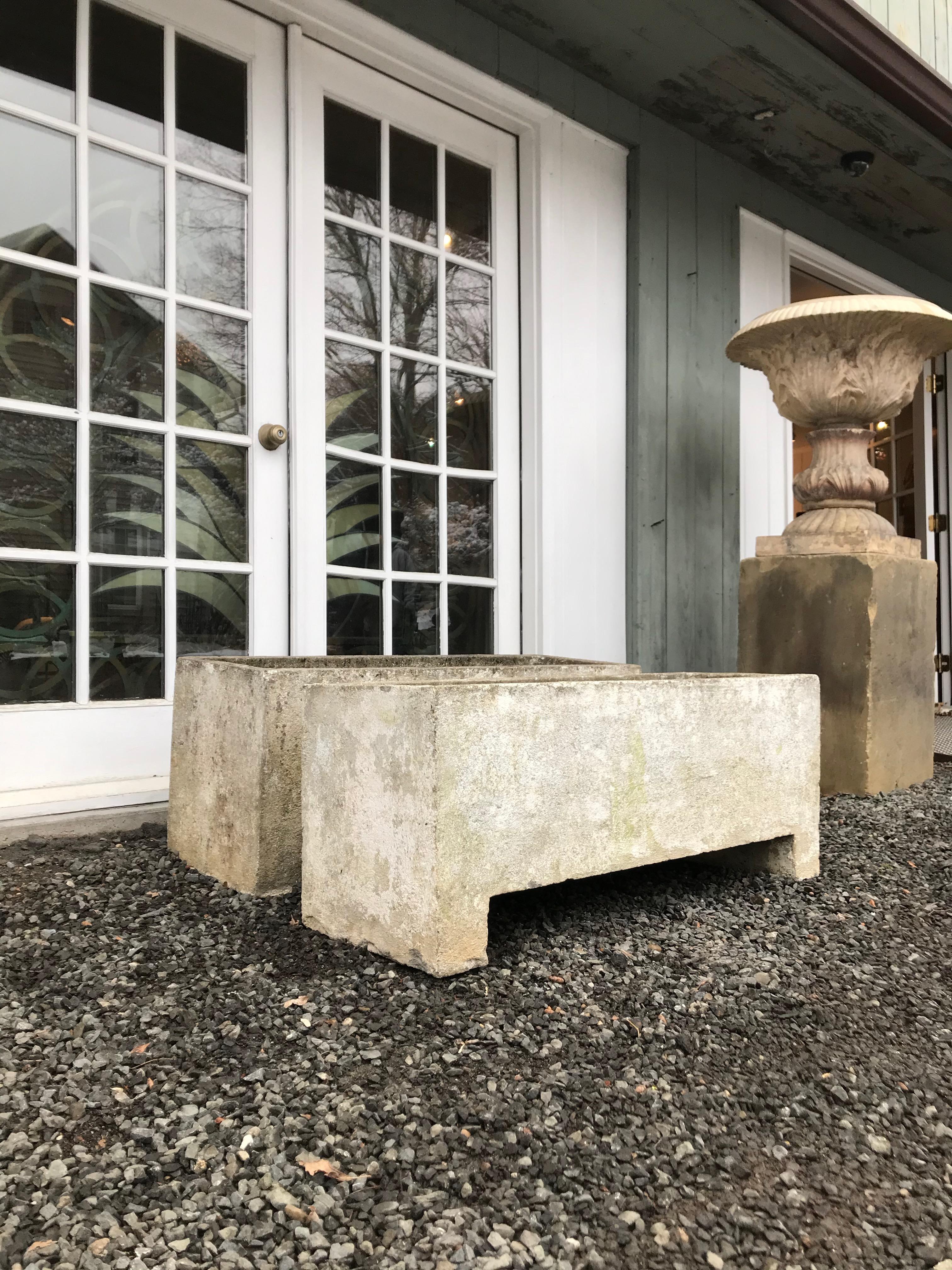 The form of these large rectangular planters is truly outstanding. With their beautiful patina and exceptionally clean lines, they would do any modern house or deck proud. There are some minor chips to both, shown in the photos, but they do not