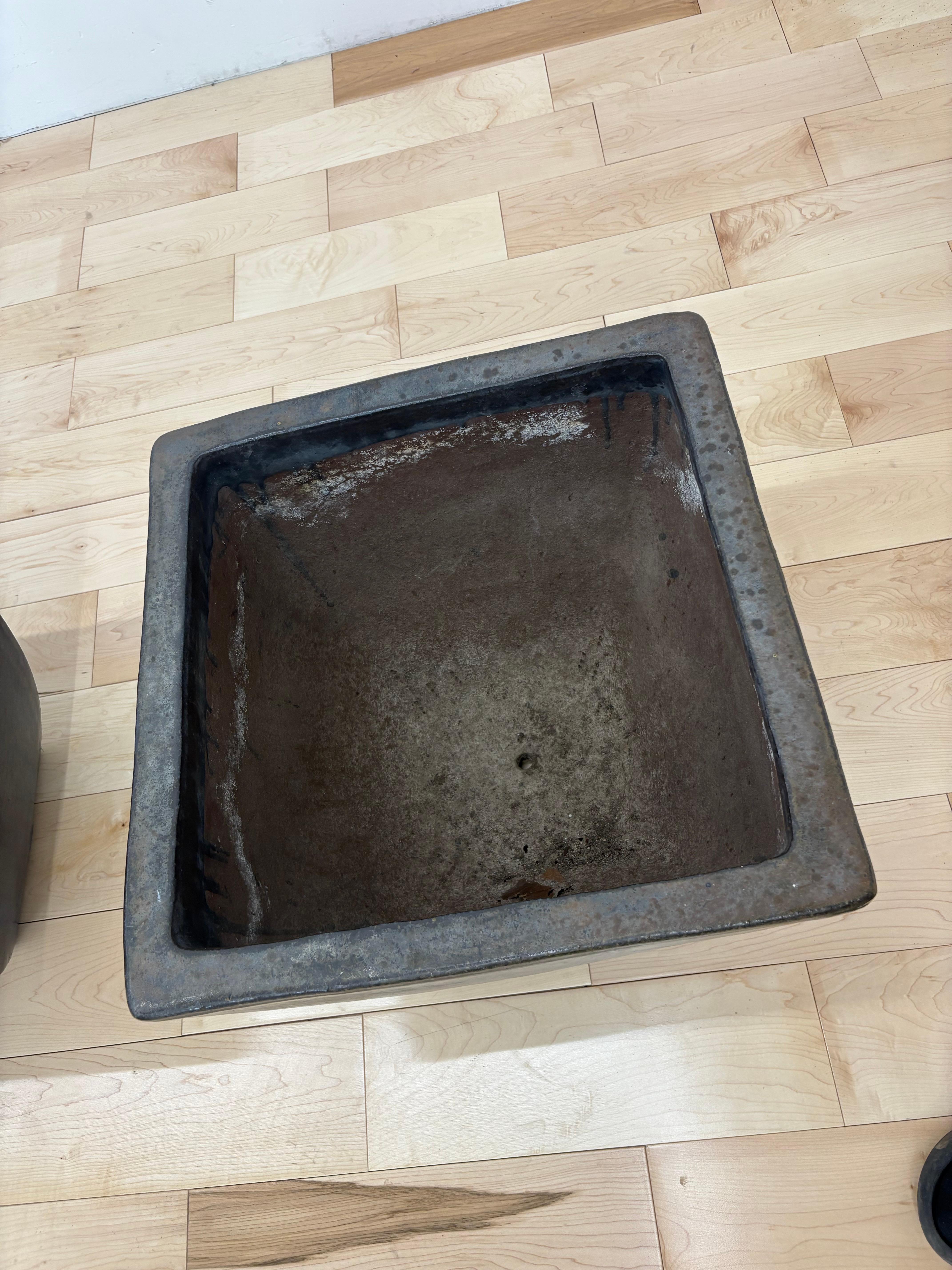 Pair of large minimalist modern cast iron planters with deep metallic glaze In Good Condition For Sale In Los Angeles, CA