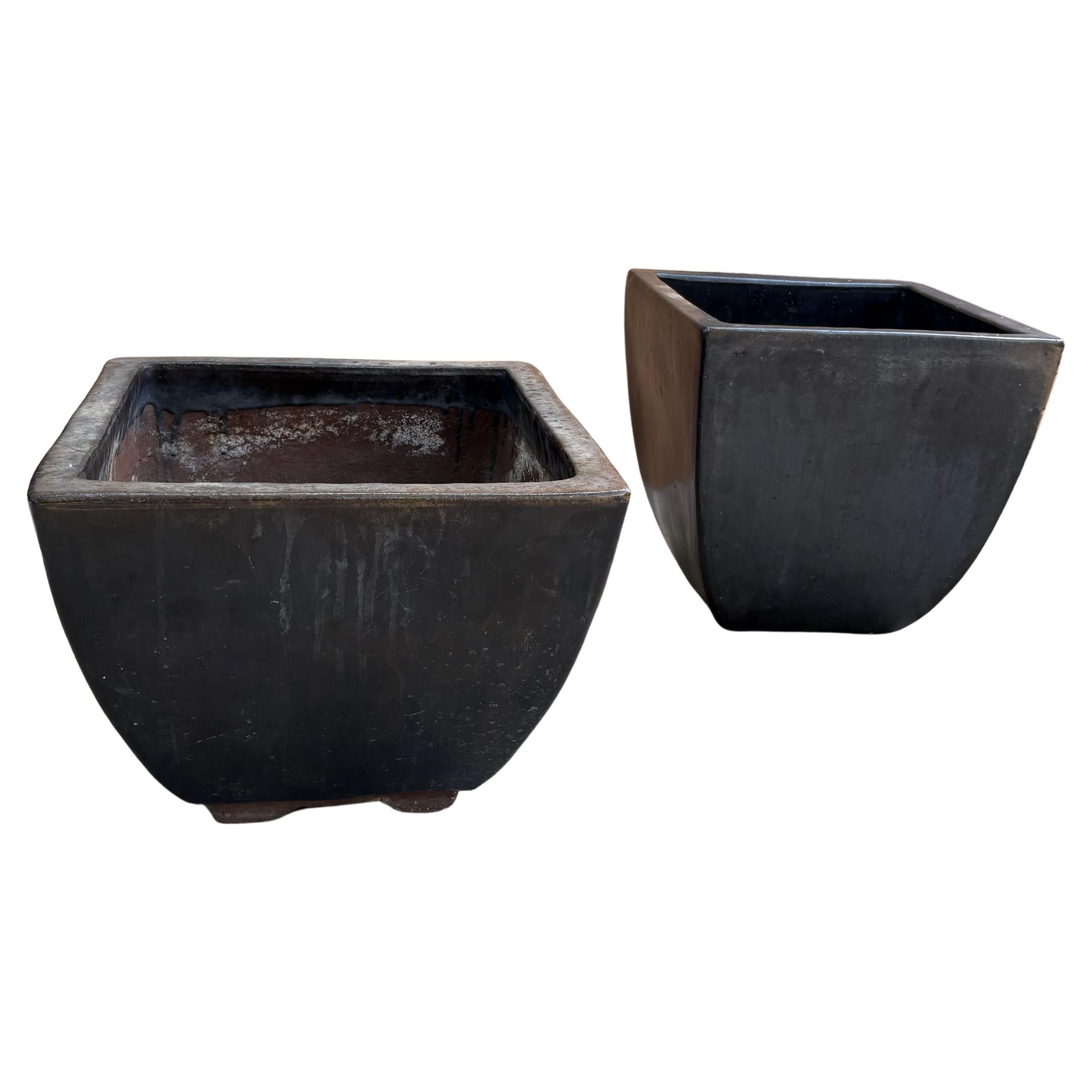 Pair of large minimalist modern cast iron planters with deep metallic glaze For Sale