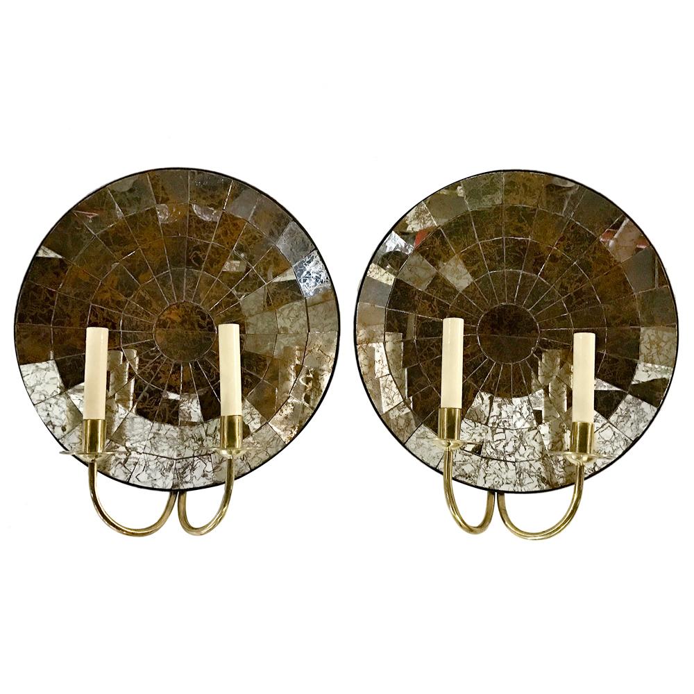 Pair of mirrored back sconces double light, polished brass body, mirror with slight gold patina, circa 1950s.

Measurements:
Height 17.5