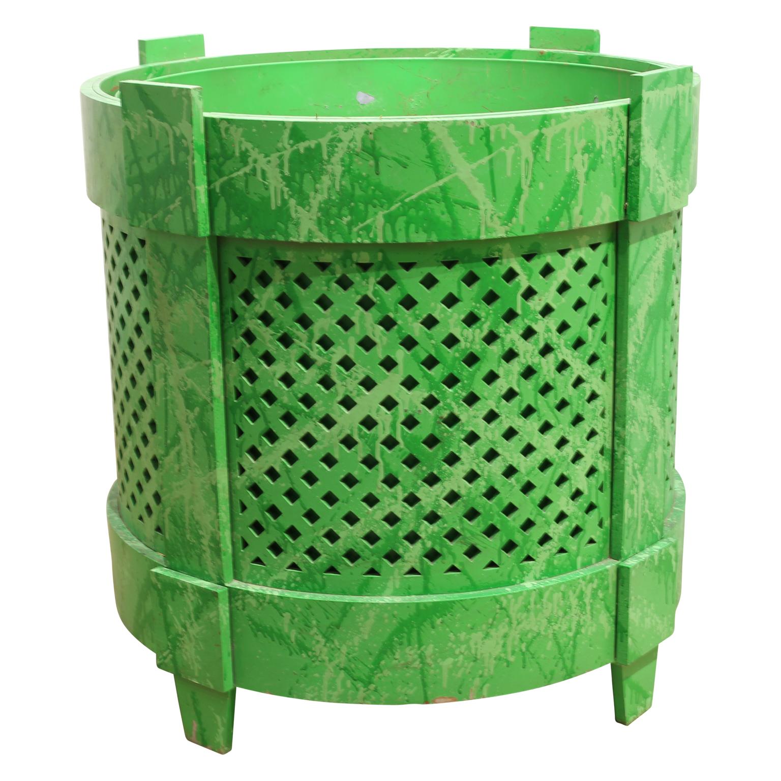Custom green Kelly Gale Amen planters that are perfect for indoor or outdoor plants. The planter was shaped using a water jet-cut and the finished with light and darker tones of green splatters. The side are grated for a functional and decorative