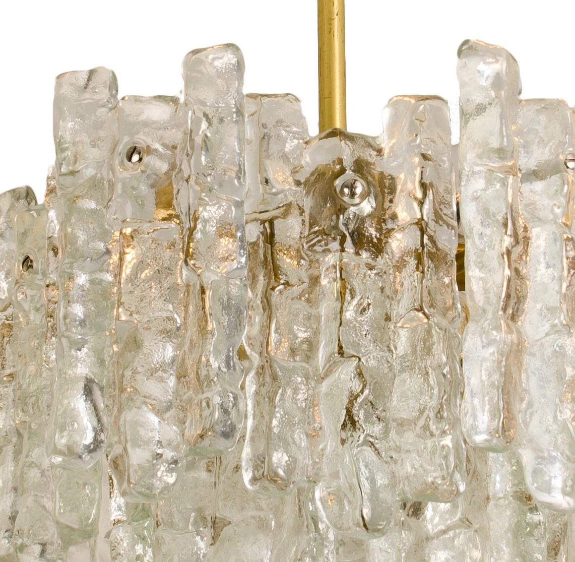 Austrian Pair of Large Modern Three-Tiered Brass Ice Glass Chandeliers by J.T. Kalmar For Sale