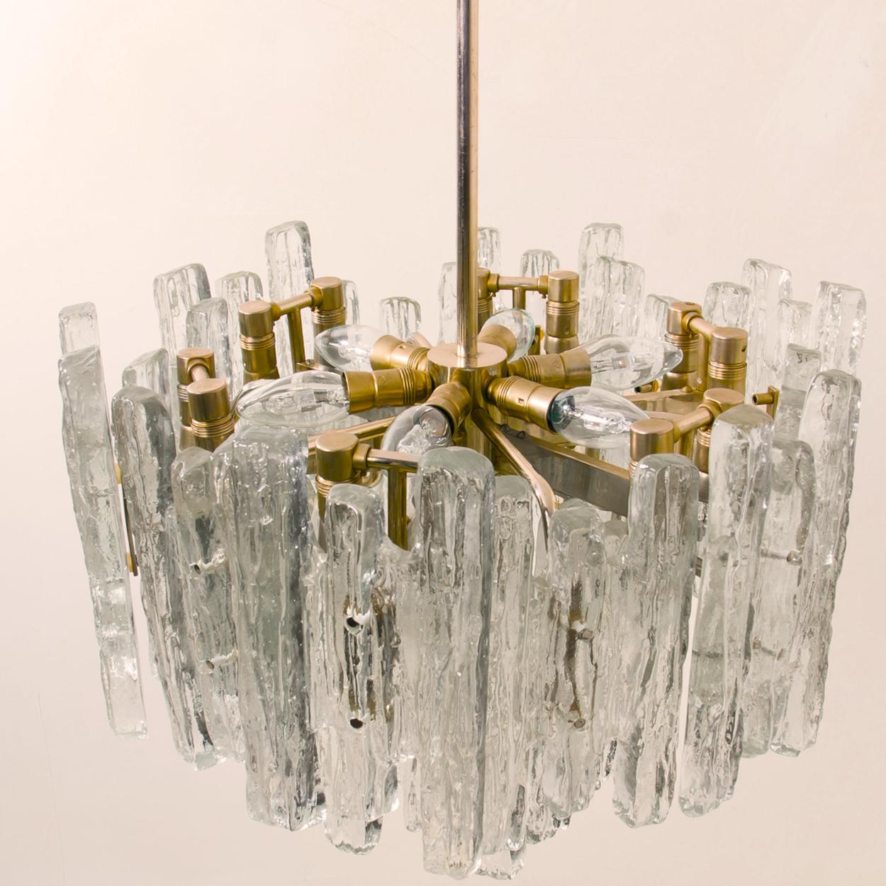 Mid-20th Century Pair of Large Modern Three-Tiered Brass Ice Glass Chandeliers by J.T. Kalmar For Sale