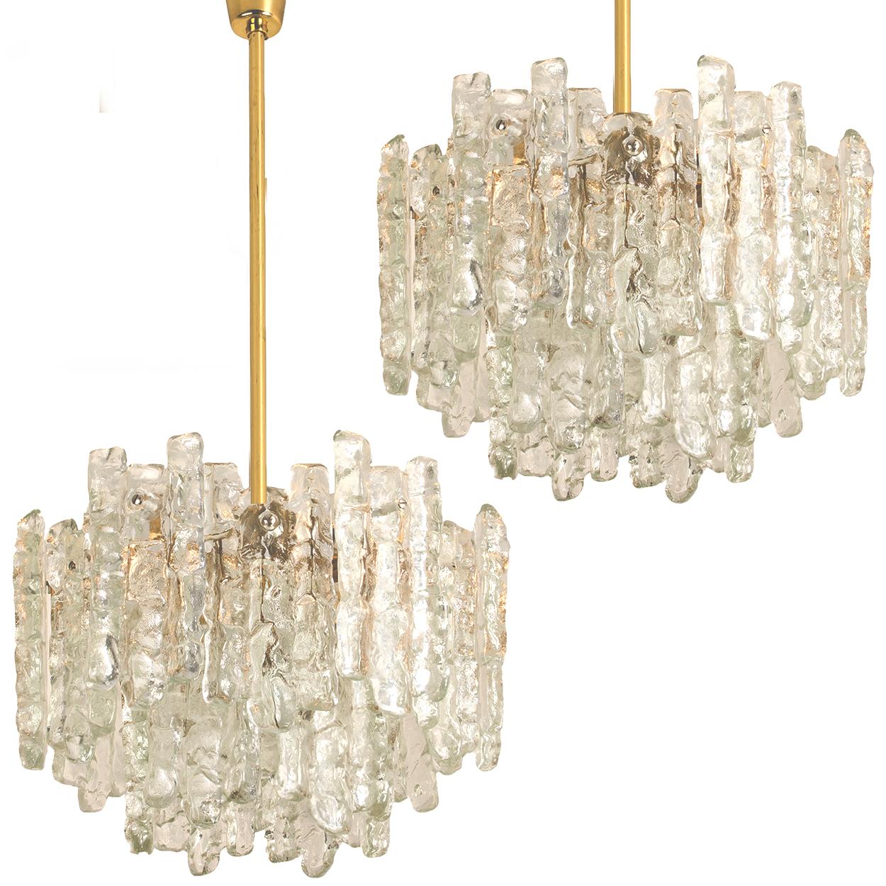 Metal Pair of Large Modern Three-Tiered Brass Ice Glass Chandeliers by J.T. Kalmar For Sale