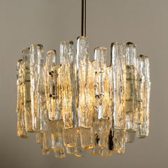 Pair of Large Modern Three-Tiered Chrome Ice Glass Chandeliers by J.T. Kalmar