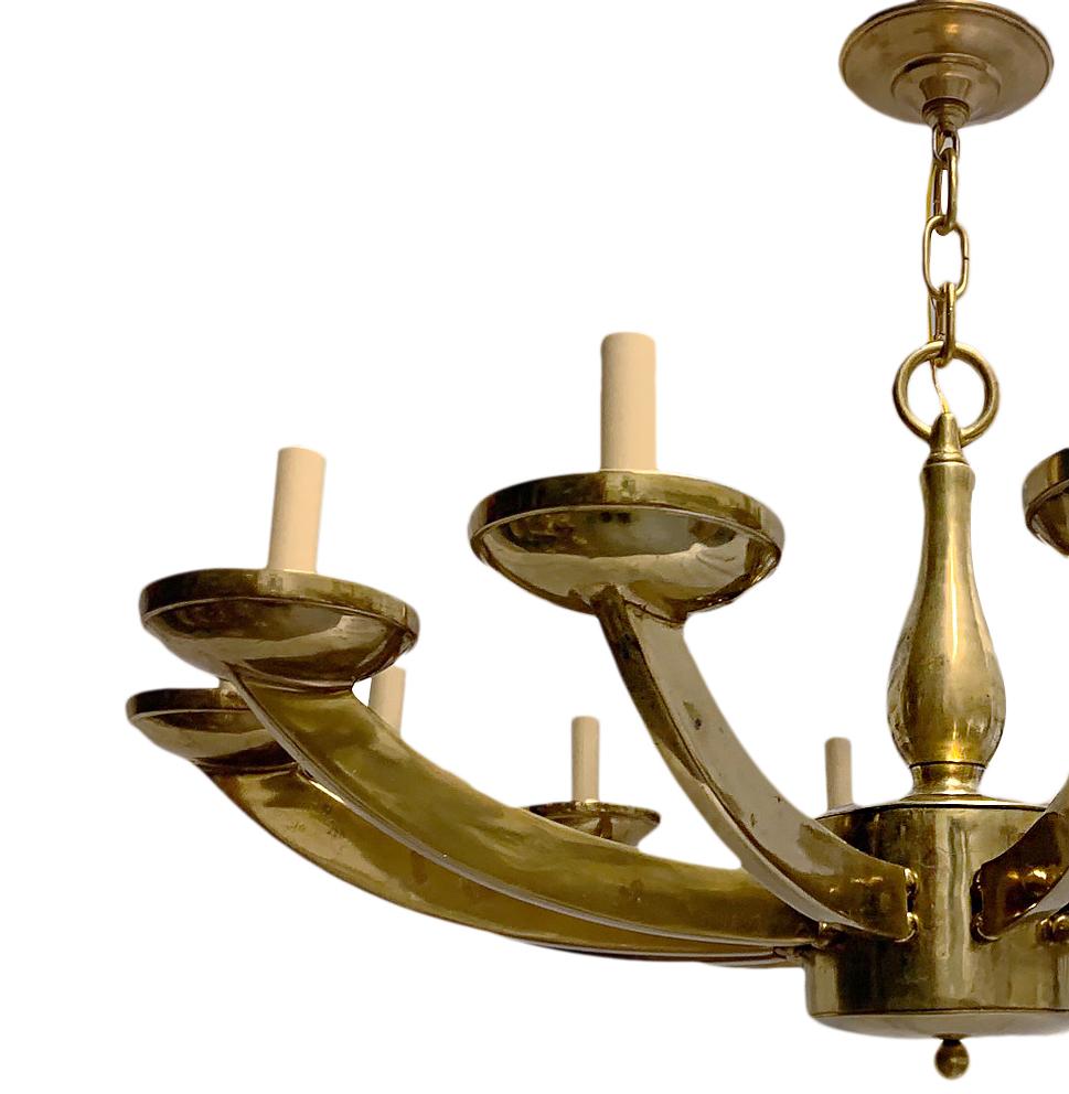 Pair of circa 1960's French Moderne sytle, cast and gilt bronze chandeliers with twelve lights each and original gilt finish. Sold individually.

Measurements:
Diameter: 36