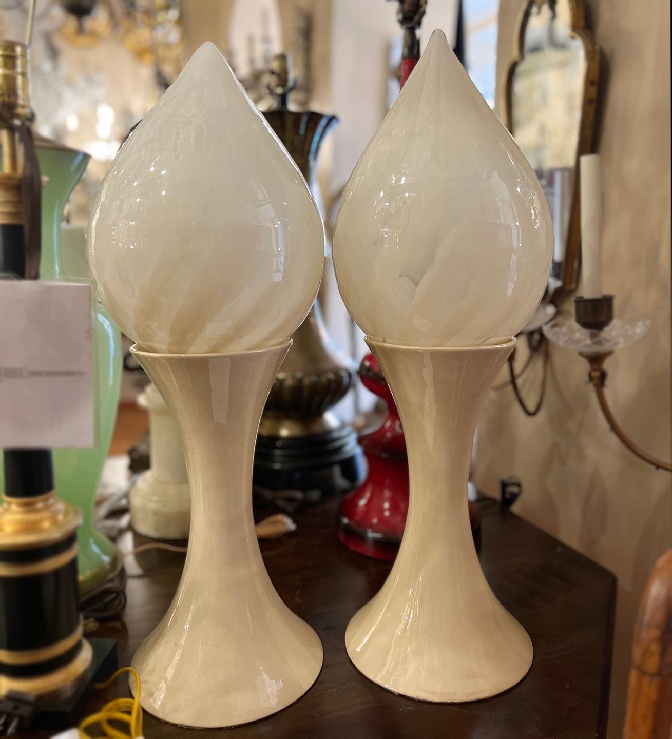 Pair of Italian circa 1960's moderne style porcelain lamps with handblown art glass shades.

Measurements:
Height: 25.5