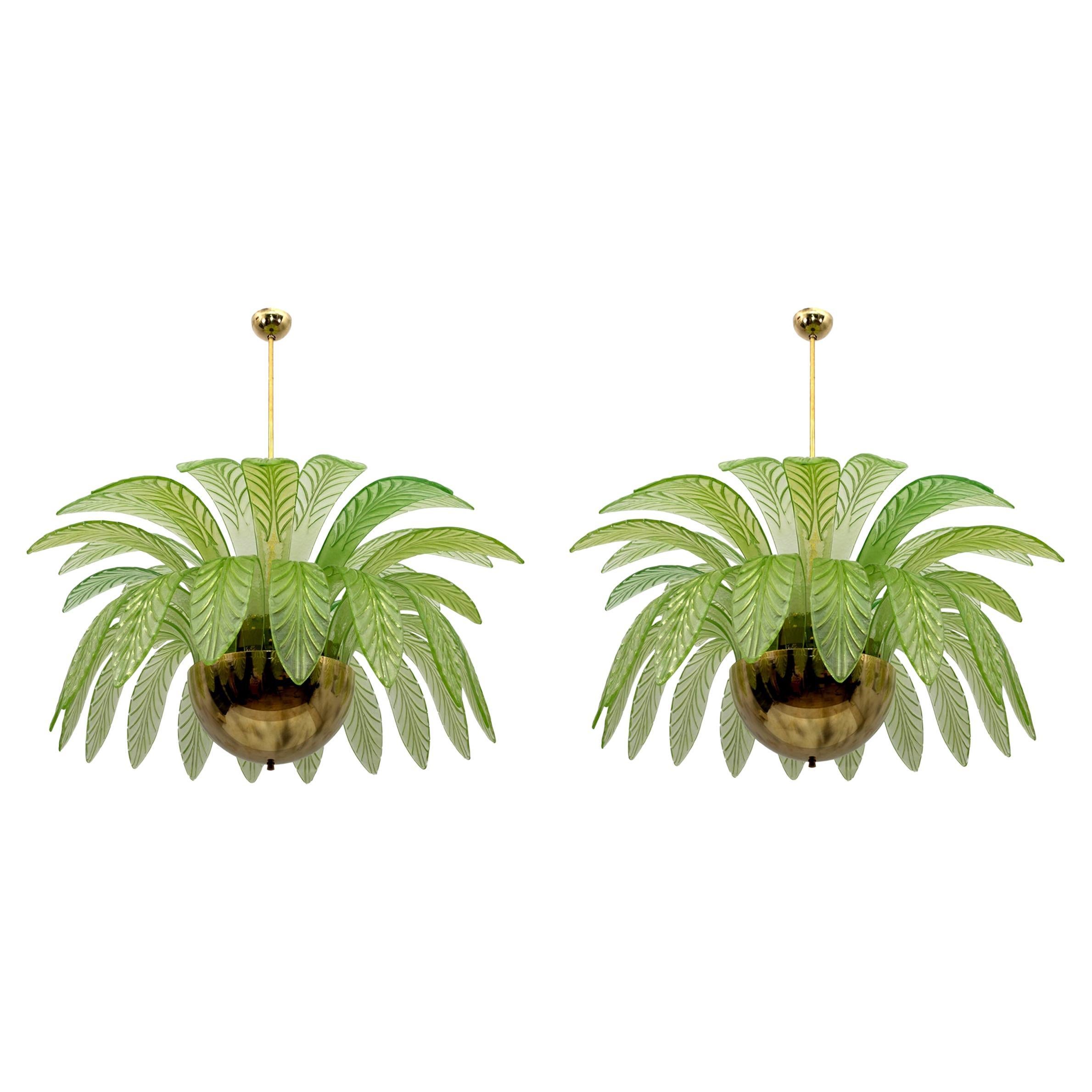 Pair of large mouth-blown Murano glass chandeliers, 38 blue Murano glass leaves in vendita