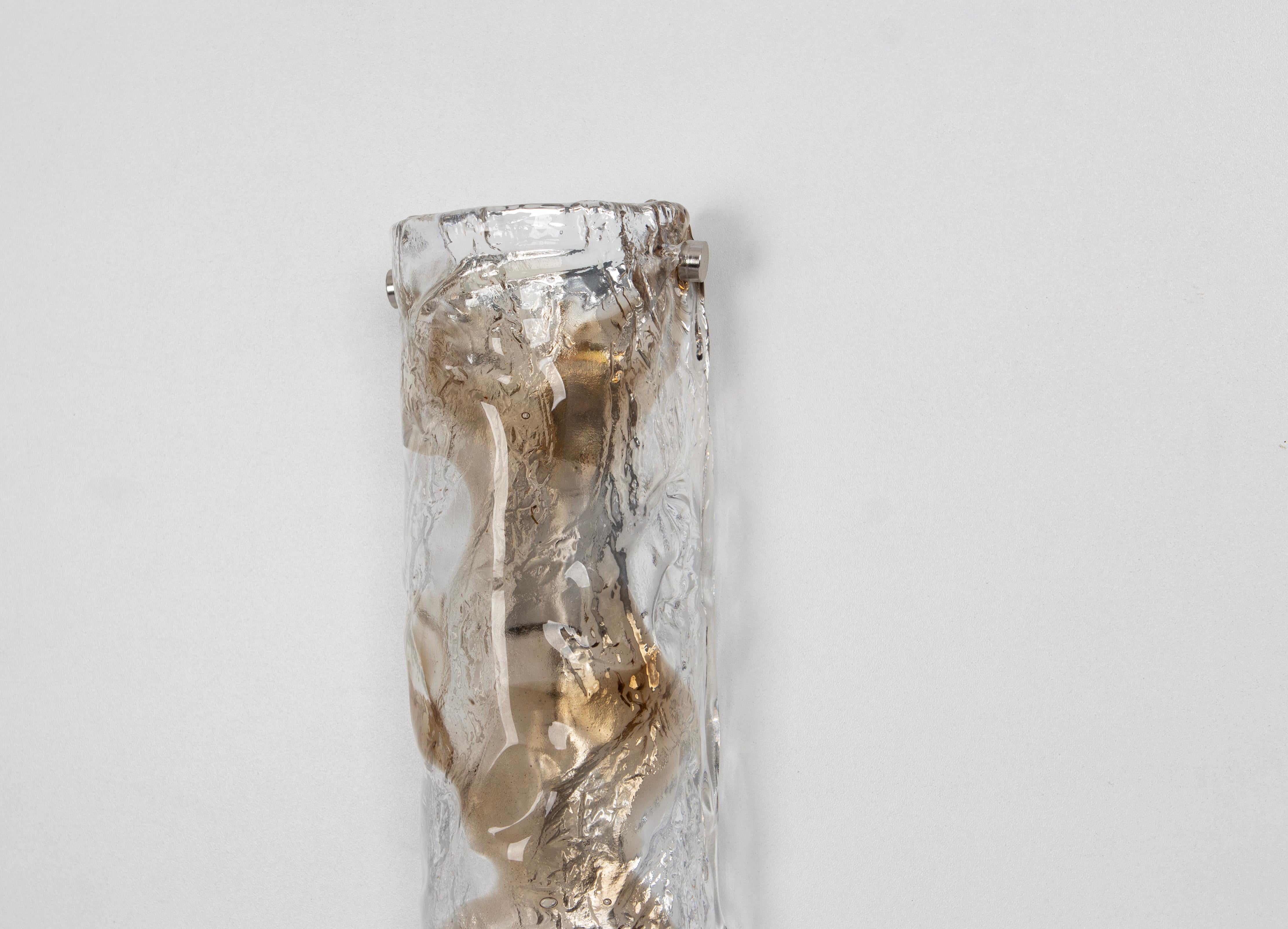 1 of 2 Wonderful pairs of midcentury wall sconces with large Murano glass pieces in each lamp, made by Kalmar, Austria, manufactured, circa 1960-1969.

Each sconce needs 1 x E14 small bulbs 
Light bulbs are not included. It is possible to install