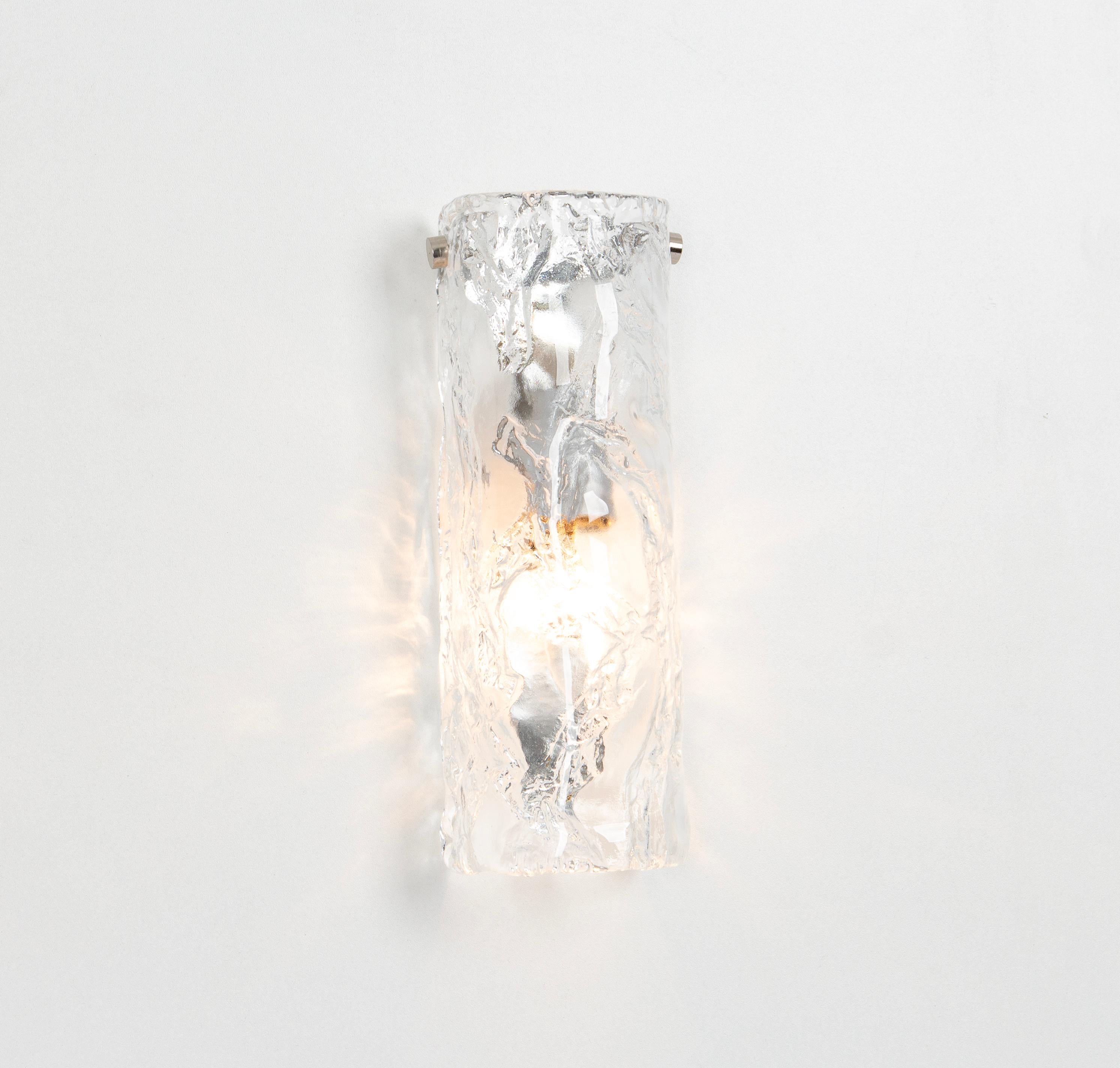  Wonderful pair of midcentury wall sconces with large Murano glass pieces in each lamp, manufactured, circa 1970-1979.

Each sconce needs 1 x E14 small bulbs 
Light bulbs are not included. It is possible to install this fixture in all countries (US,