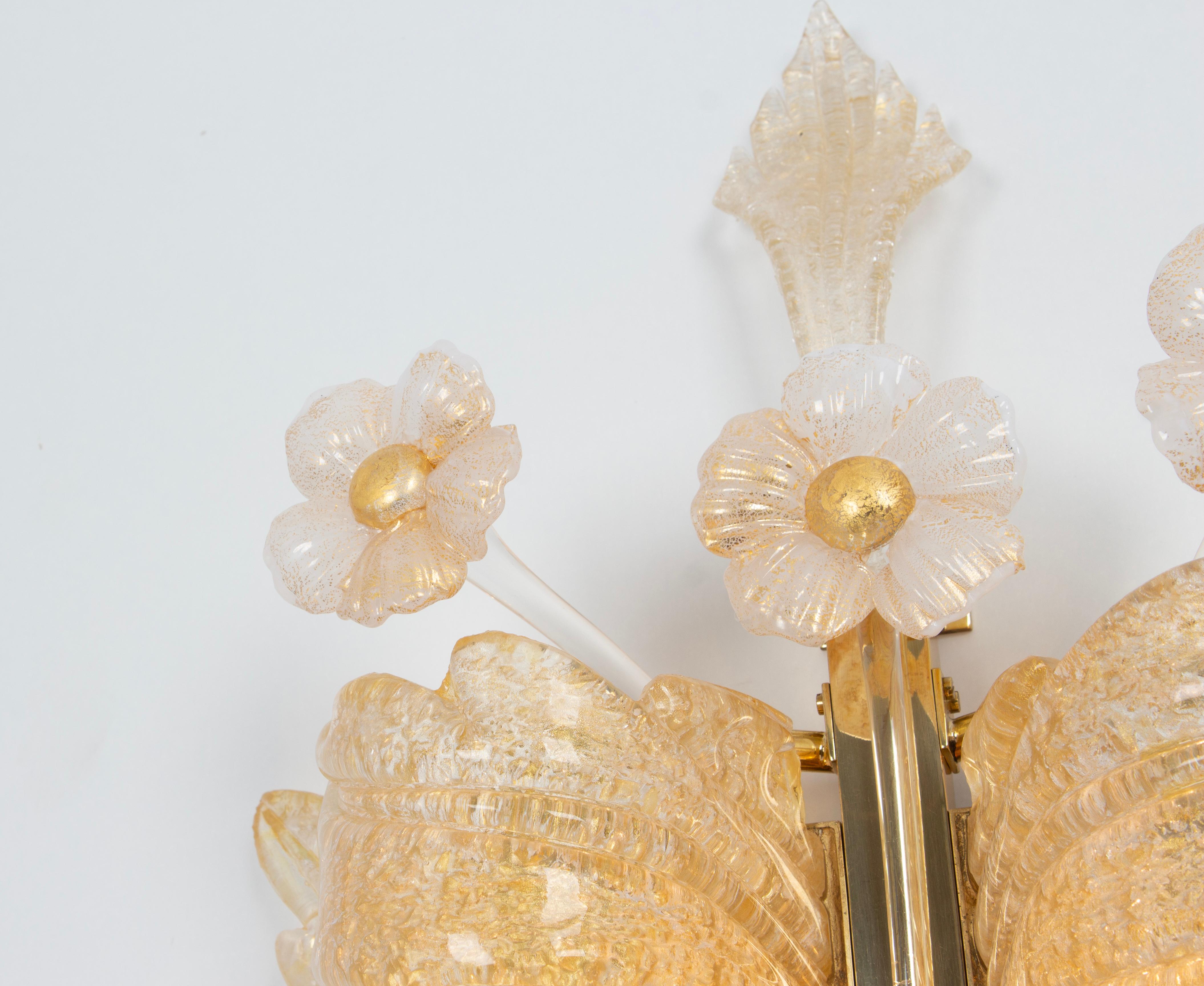 A gorgeous set of 2 sconces with 24-karat gold made by Barovier & Toso, Italy, circa 1970-1979.
High quality, Handmade, and in very good condition. Cleaned, well-wired, and ready to use.

Each sconce requires 2 x E14 standard bulbs with 60 W