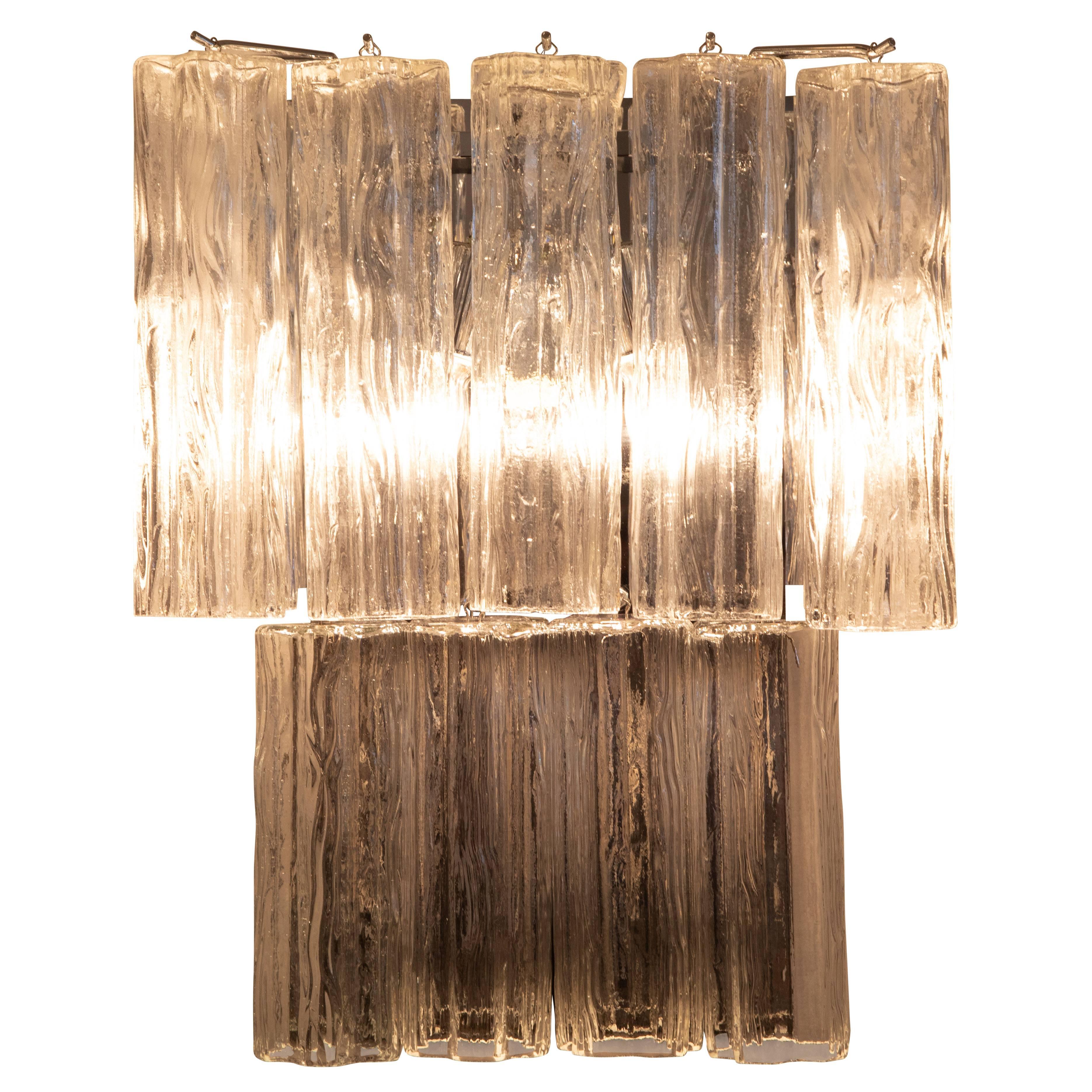 Large-scale Murano sconces featuring tronchi crystals mounted on chrome fixtures, circa 1970s. Each sconce holds seven 10-inch crystals over four 8-inch crystals and is illuminated by two standard-base bulbs. Hard-wire installation required. Two