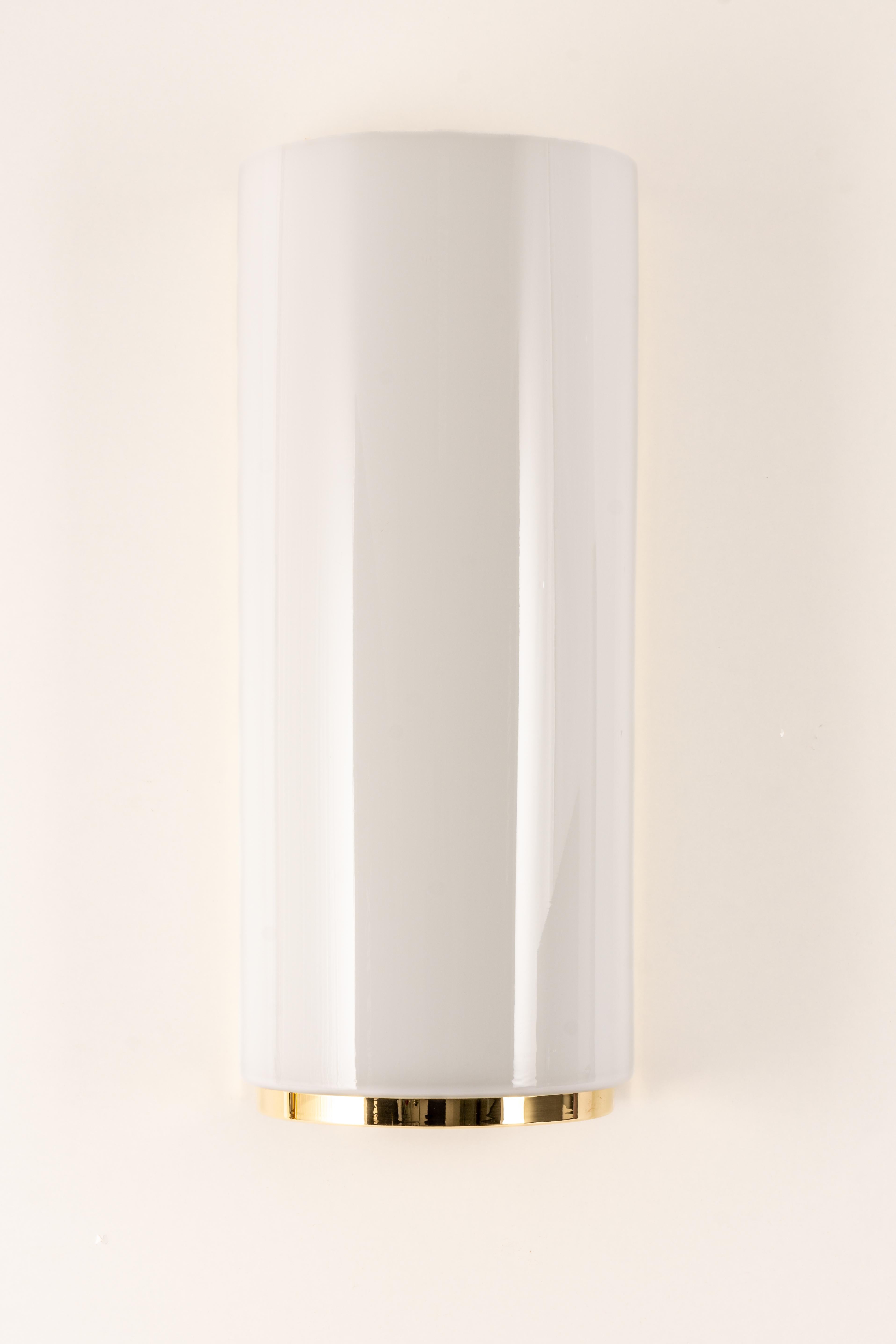 Stunning pair of opal white glass sconces made by Limburg on a brass frame.
Best of the 1970s from Germany

Each Sconce takes 2 x E27 standard bulbs
Light bulbs are not included. It is possible to install this fixture in all countries (US, UK,