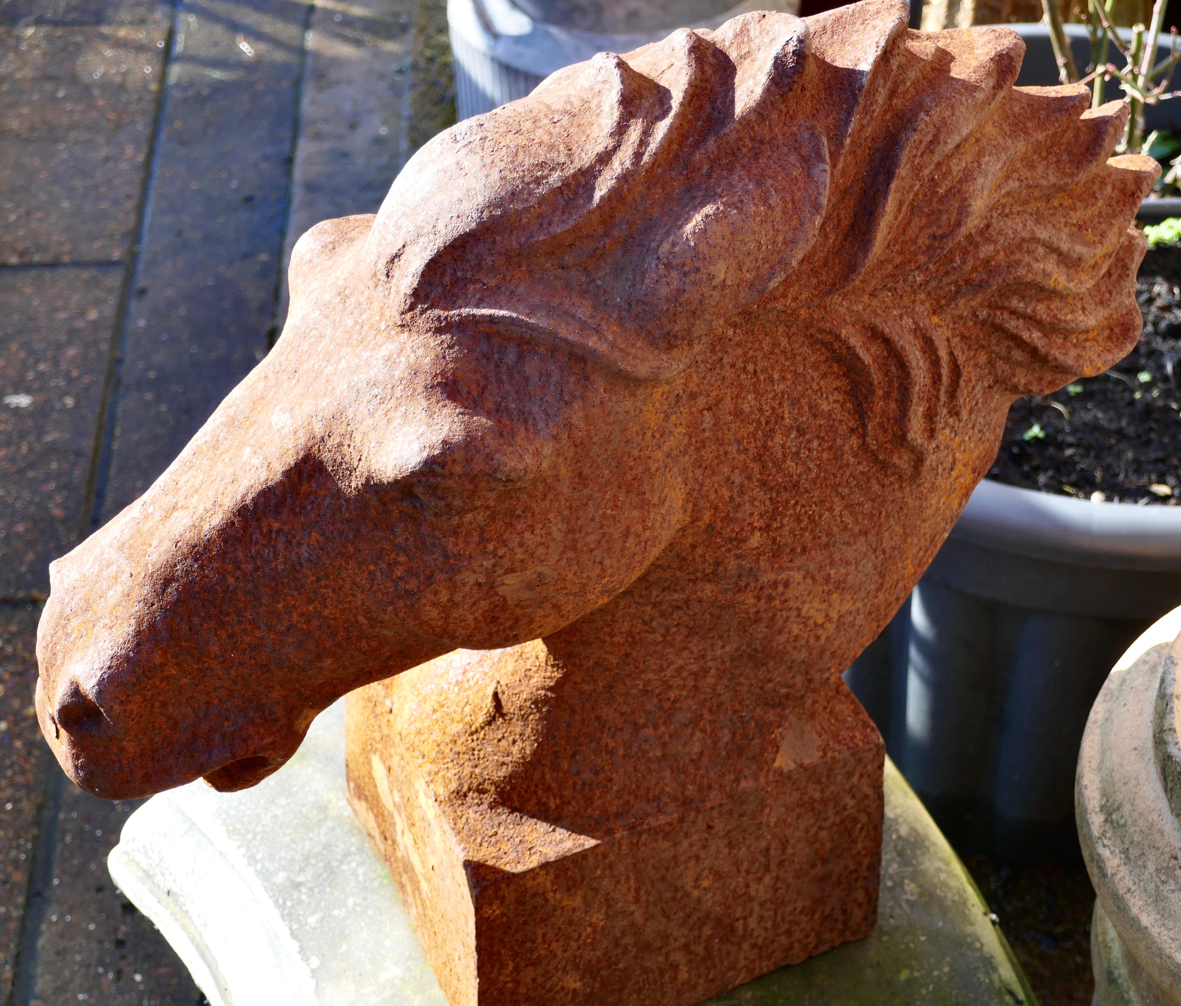 20th Century Pair of Large Outdoor Weathered Cast Iron Horse Heads